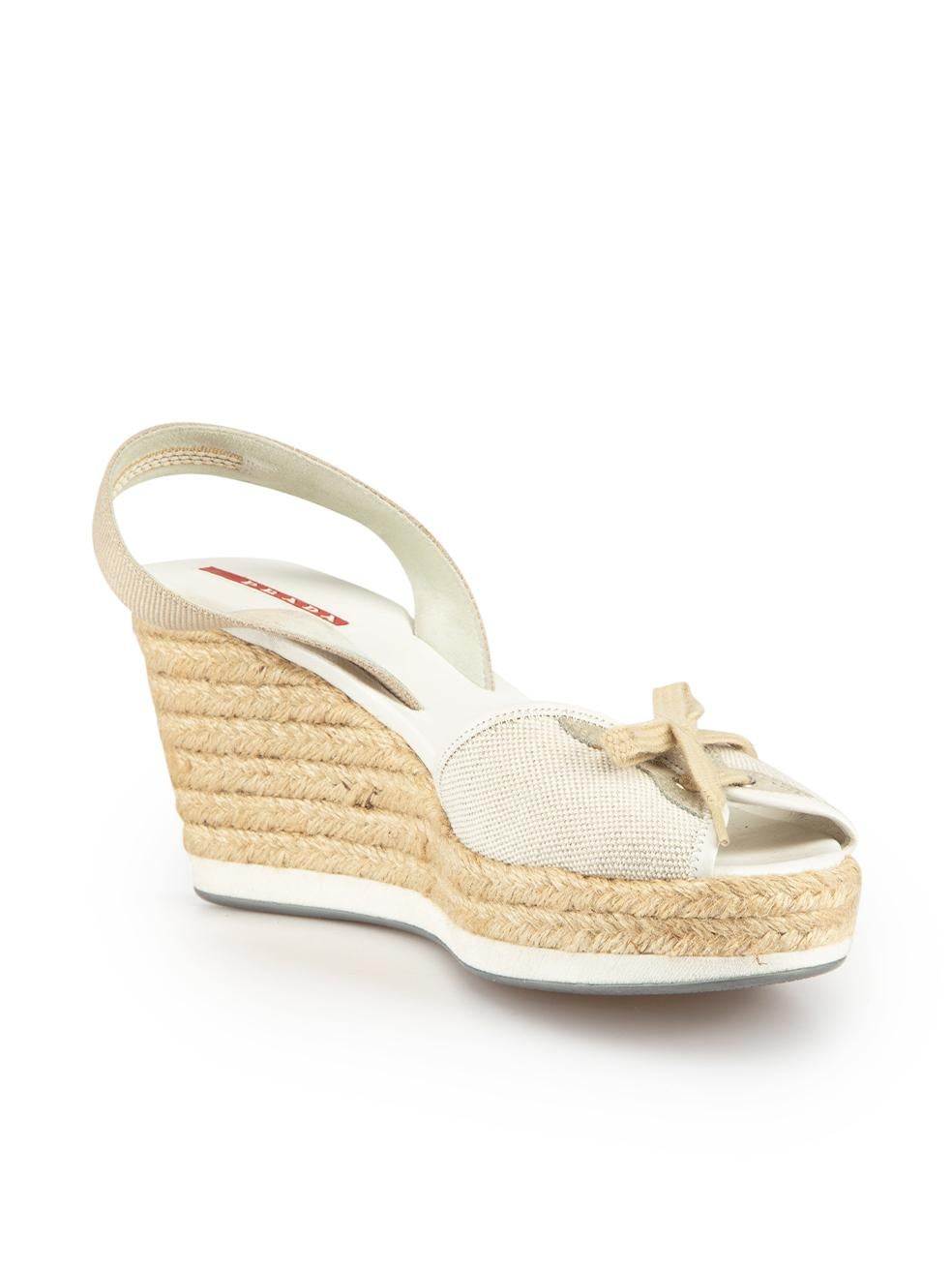 CONDITION is Very good. Minimal wear to shoes is evident. Minimal wear to right shoe slingback strap and upper with discoloured marks to the canvas. Both shoes also have dark marks to the rubber sole trims - particularly at the heels and glue