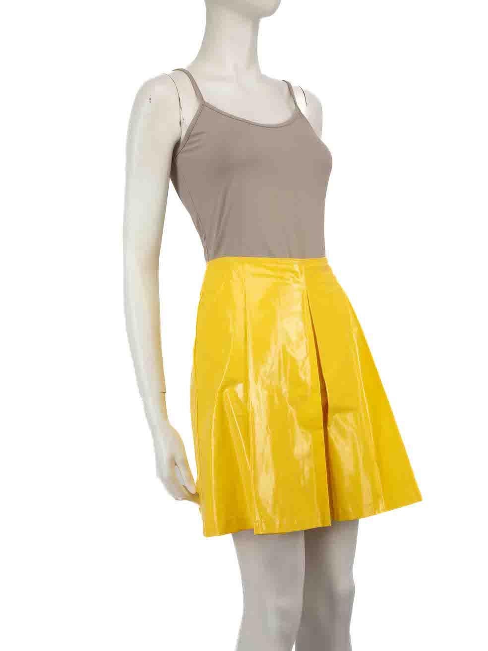 CONDITION is Very good. Minimal wear to skirt is evident. Minimal discolouration to centre front, left pocket and rear. Small scratches are seen front on this used Prada Sports designer resale item.
 
 
 
 Details
 
 
 Yellow
 
 Resin coated cotton
