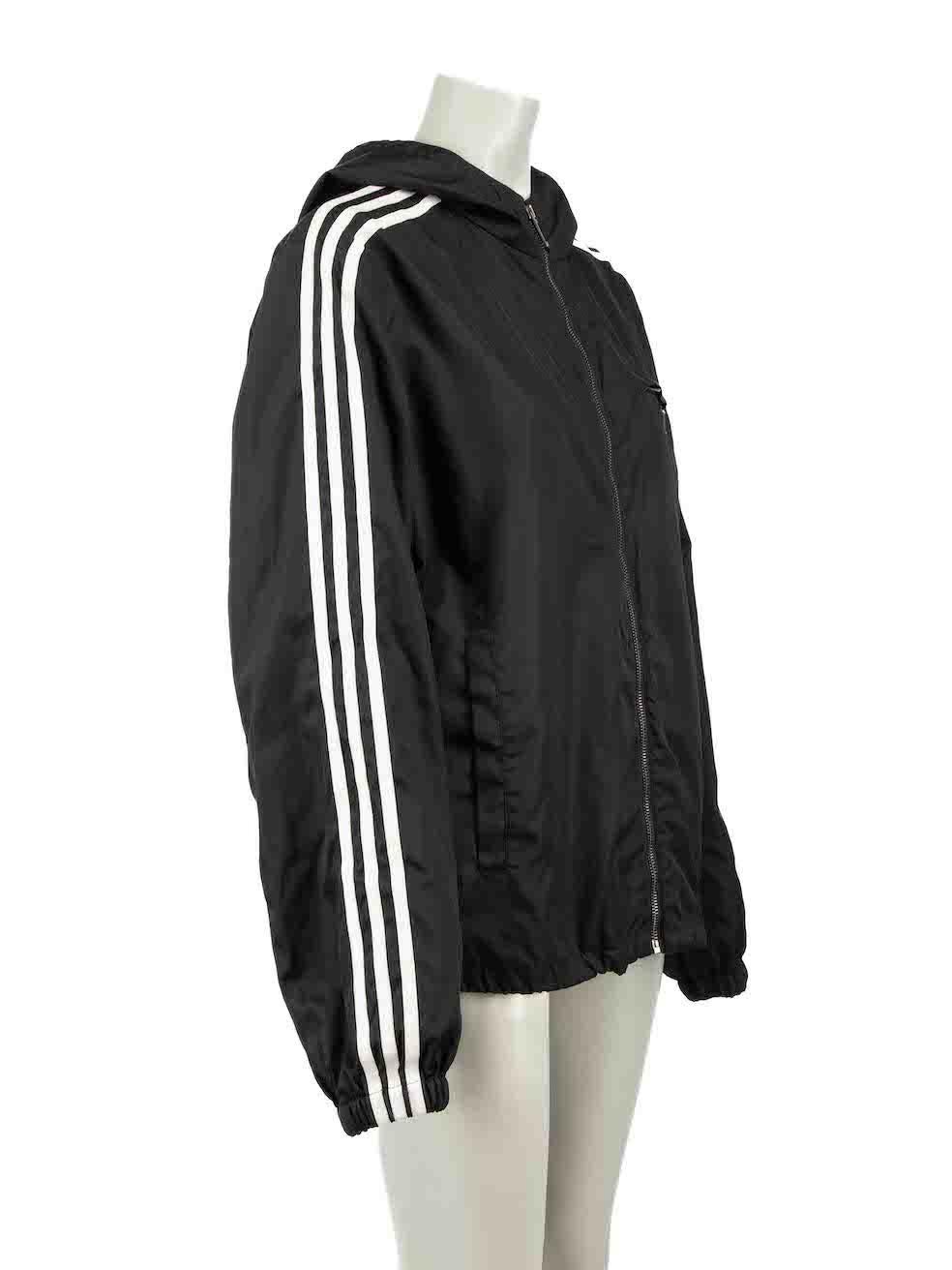 CONDITION is Very good. Hardly any visible wear to jacket is evident on this used Prada X Adidas designer resale item.
 
Details
Unisex
Black
Re-nylon
Track jacket
Front zip closure
Striped accent on sleeves
Hooded with drawstring
2x Front side