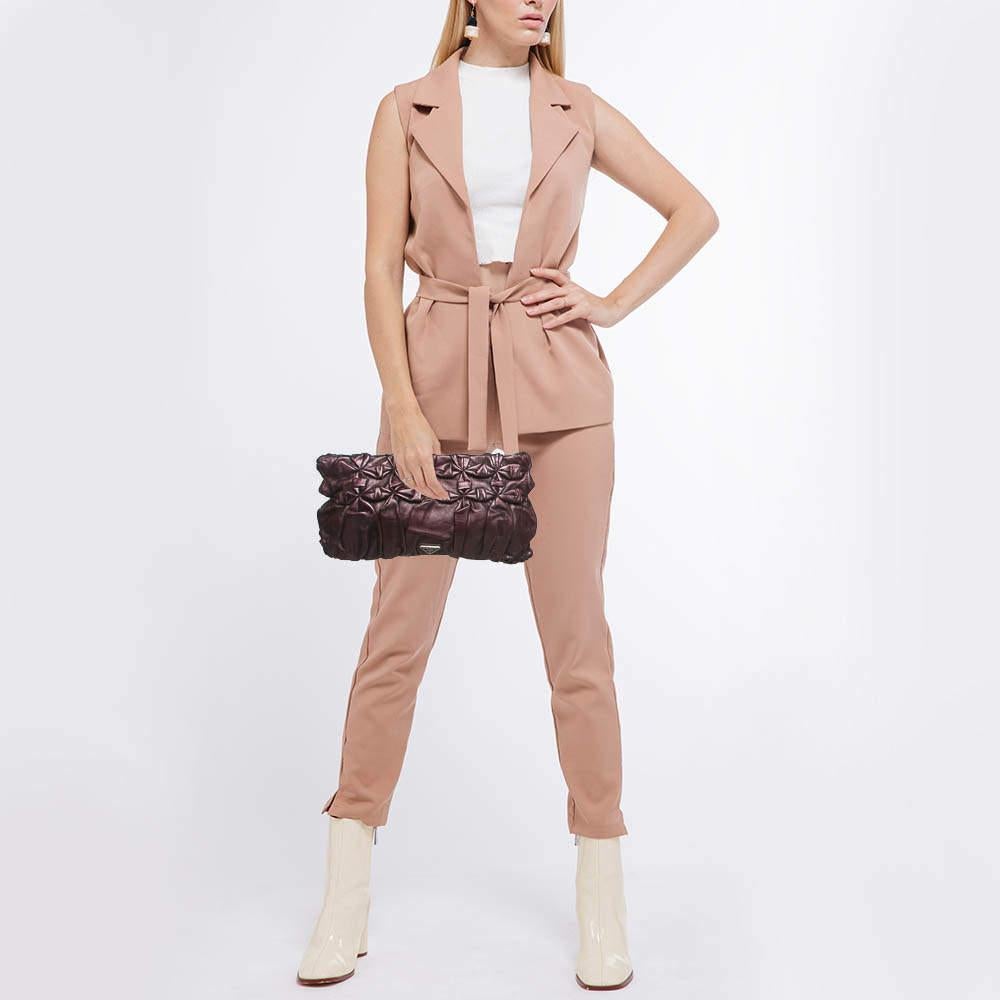 This clutch is just the right accessory to compliment your chic ensemble. It comes crafted in quality material featuring a well sized interior that can comfortably hold all your little essentials.