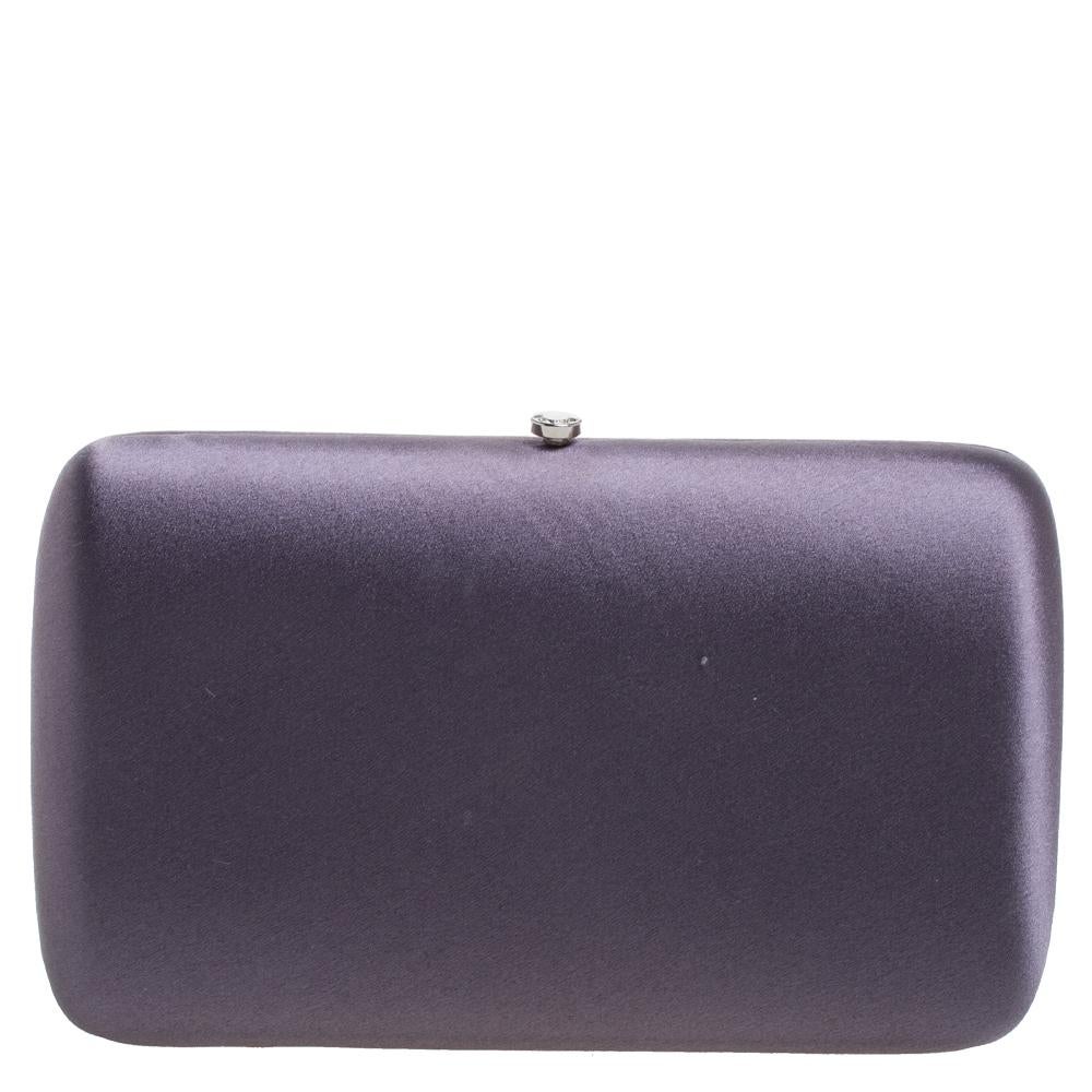 Everybody loves chic accessories that come with an edge. From the house of Prada comes this gorgeous box clutch that will perfectly complement all your outfits. It has been crafted from stunning purple-hued satin and silver-tone metal and styled