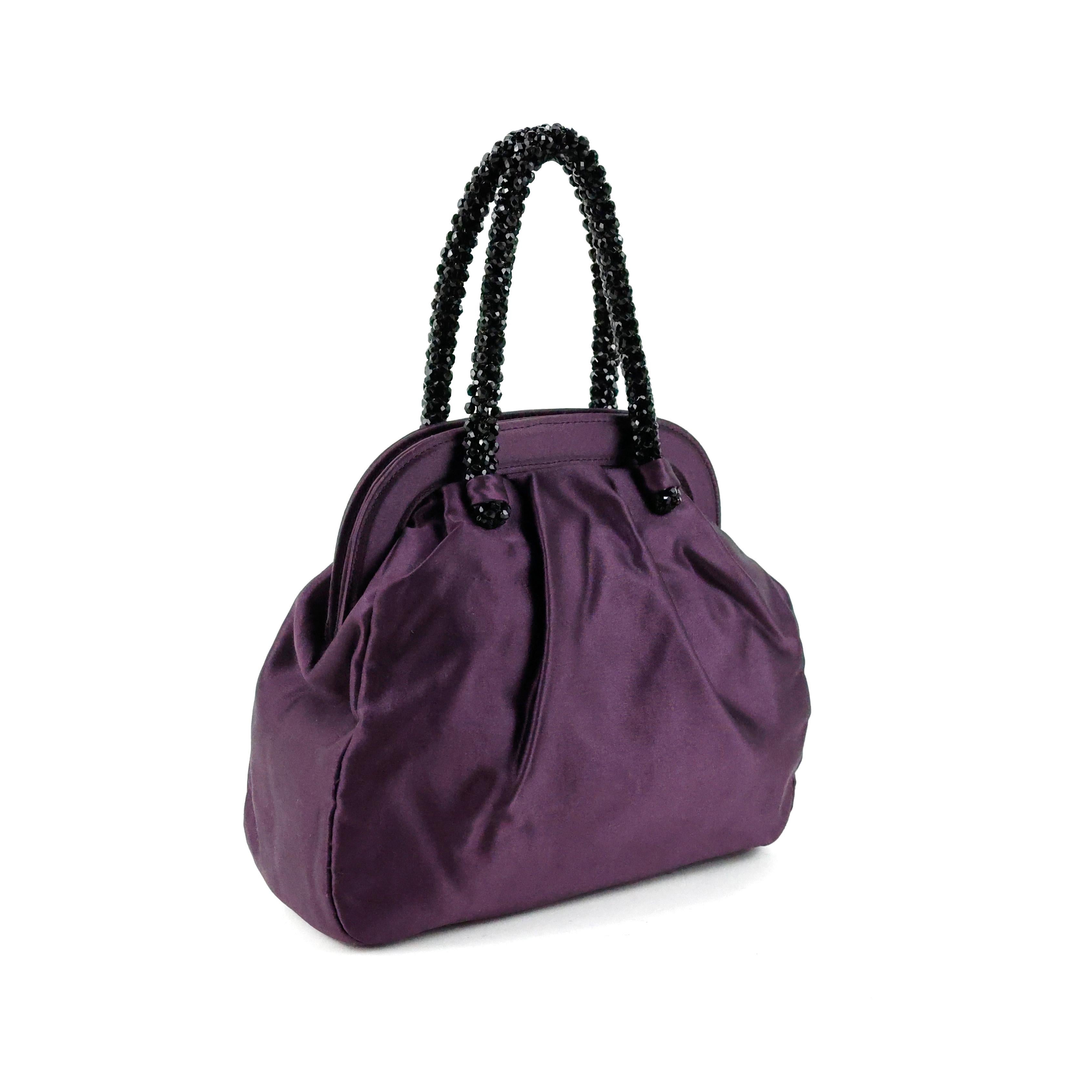 Prada purse in silk color purple, dark stones handle, gold hardware. 

Condition:
Really good.

Packing/accessories:
Dustbag.

Measurements:
Width: 20 cm
Height: 21 cm
Depth: 8 cm