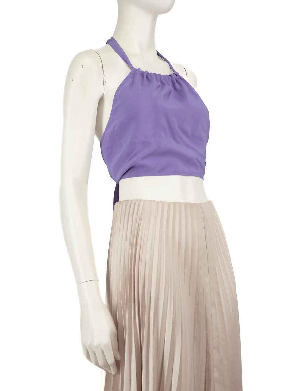 CONDITION is Very good. Minimal wear to the top is evident. There are pulls to the weave on the inner right side of the top. The brand label is also loose on this used Prada designer resale item.
 
 Details
 Purple
 Silk
 Top
 Cropped fit
 Halter