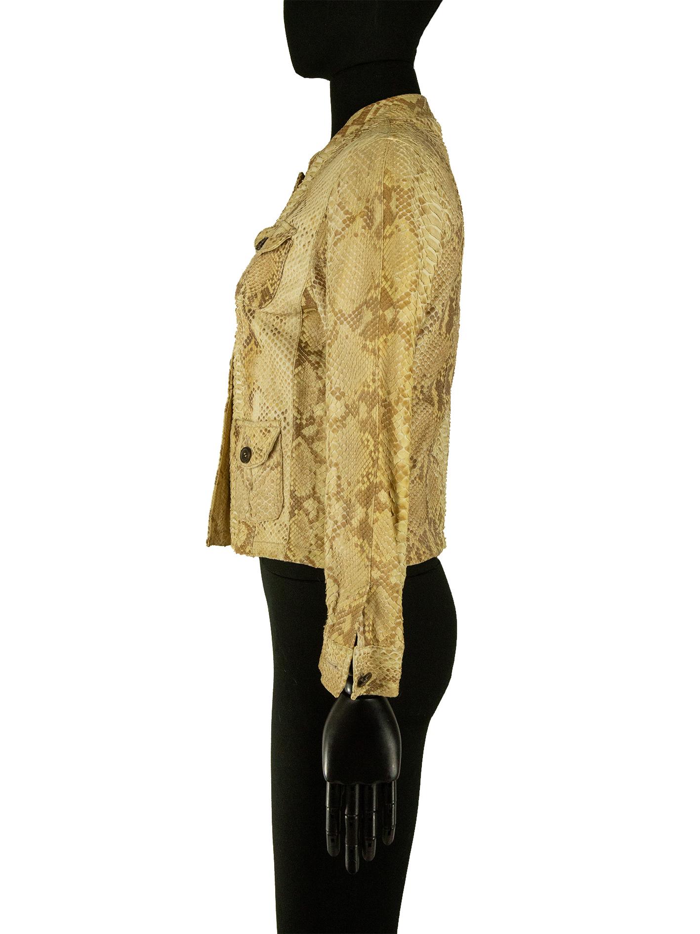 A Prada jacket in python skin. This jacket features all-over python skin with varying scale sizes. The jacket has a mandarin collar that fastens with brown marble effect buttons, which are carried down the front of the jacket. There are four pockets