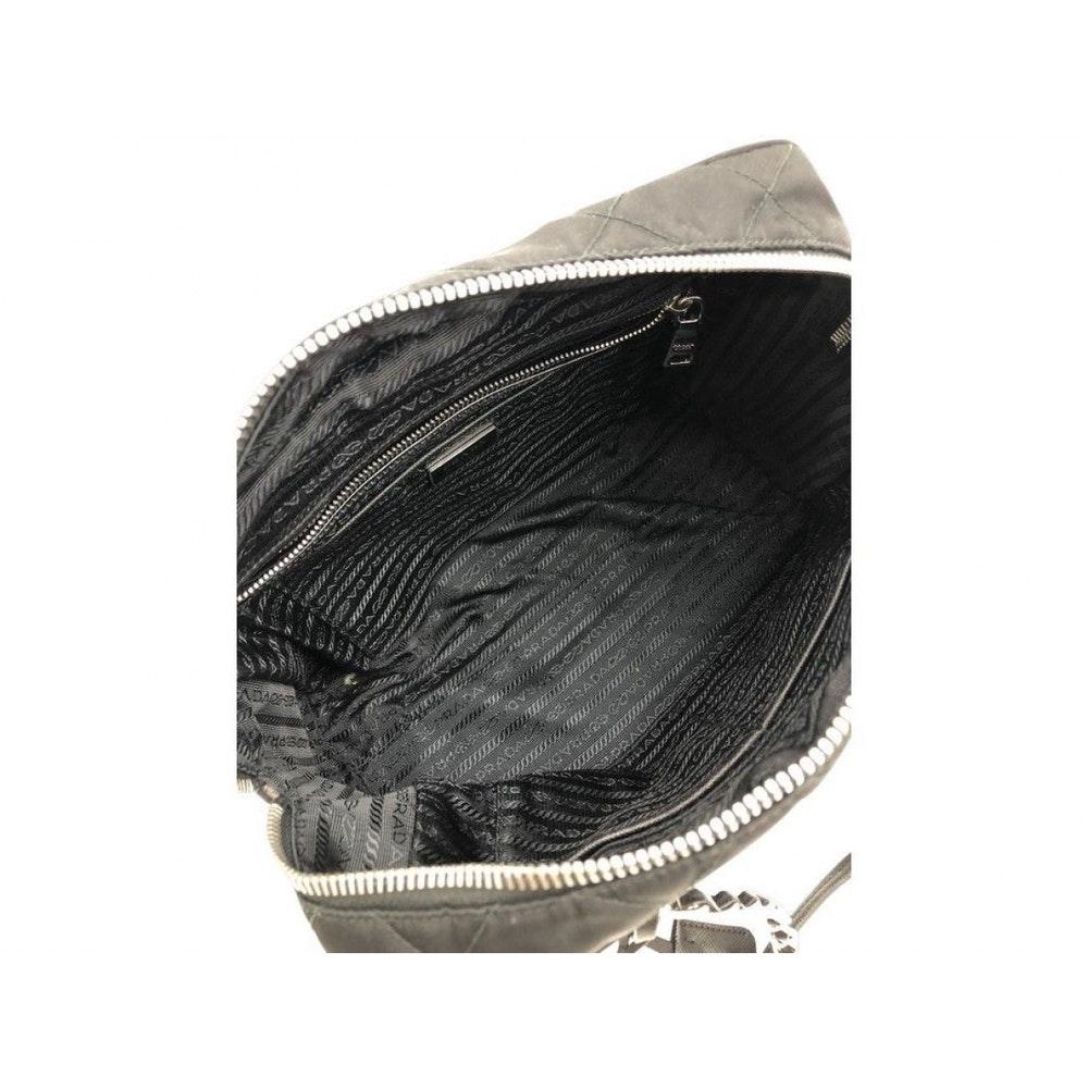 Great bag by Prada in quilted Nylon. The silver hardware next to the nylon just pops put. Wear on the shoulder, handhold or wear on the crook of the arm. A preloved bag in very good condition.

BRAND	
Prada

ACCESSORIES	
Autehnticity card, Dust bag,