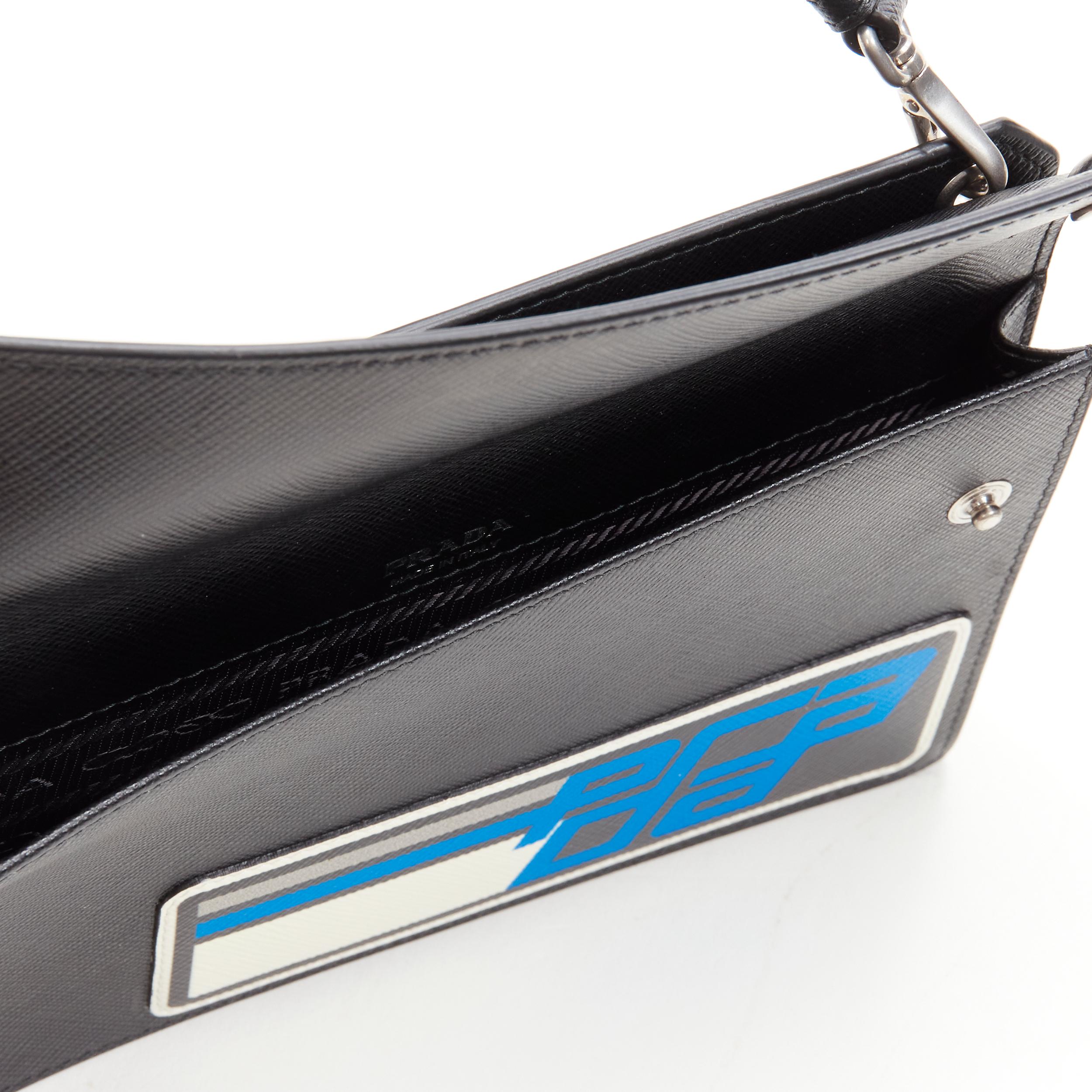 PRADA Racing Graphic Logo black saffiano flap front pocket flat top handle bag For Sale 1