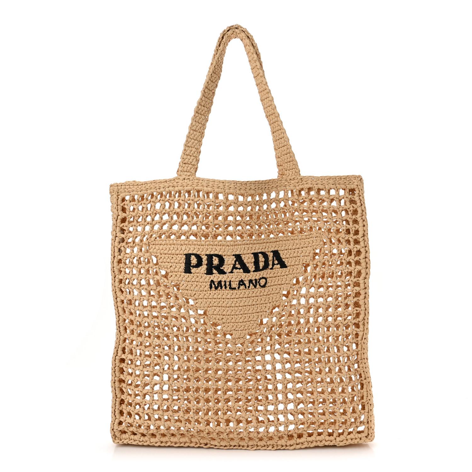 This is an authentic PRADA Raffia Embroidered Logo Tote Bag in Naturale. This stylish tote is crafted of natural color raffia. The bag features a black Prada on the front and an unlined interior.

Base length: 14 in
Height: 14.25 in
Width: 1.5