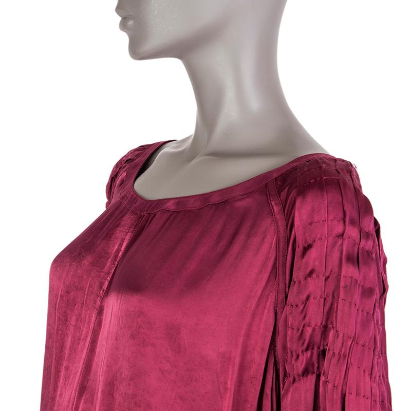 Prada long-sleeve shift dress in raspberry cupro (100%). With pleated bishop sleeves and staight yoke on the back. Unlined. Closes with hook and invisible zipper on the back. Has been worn and is in excellent condition. 

Tag Size 44
Size L
Bust
