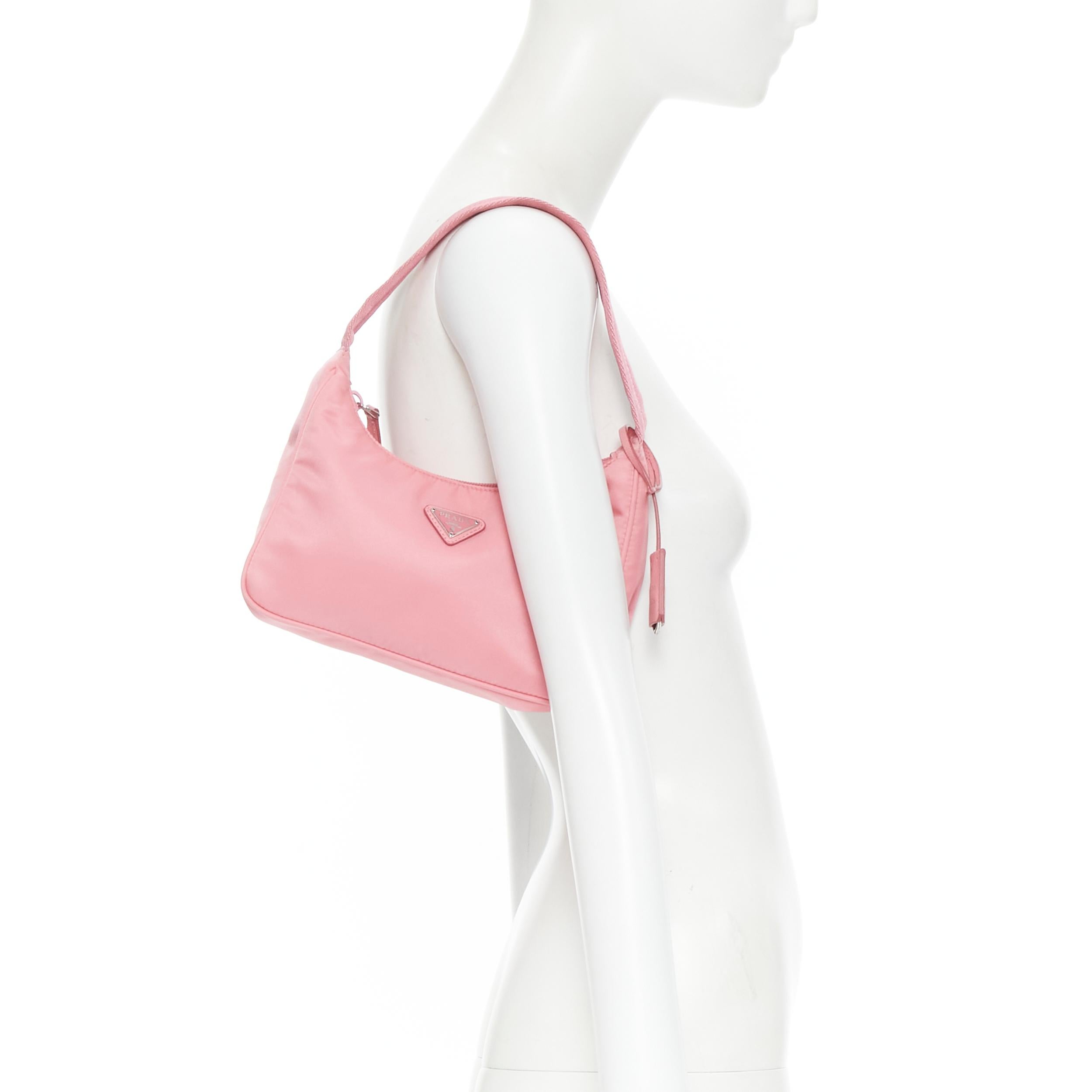 PRADA Re Edition 200 pink Tessuto Nylon saffiano trim underarm bag 
Reference: TGAS/B01616 
Brand: Prada 
Designer: Miuccia Prada 
Model: Re Edition 200 
Material: Nylon 
Color: Pink 
Pattern: Solid 
Closure: Zip 
Extra Detail: Re Edition 2000 Mini