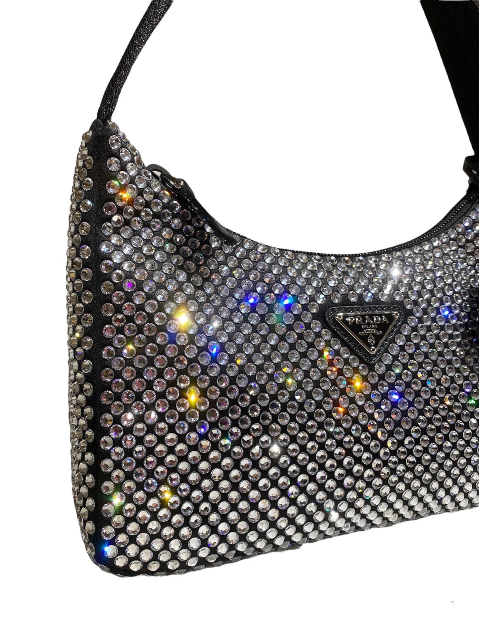 Bag, signed Prada, re-edition 2000 model, made of black fabric covered with multicolor rhinestones, with silver hardware. Equipped with a zip closure, internally lined in black satin, roomy for the essentials.

Equipped with a fabric handle, 2 cm