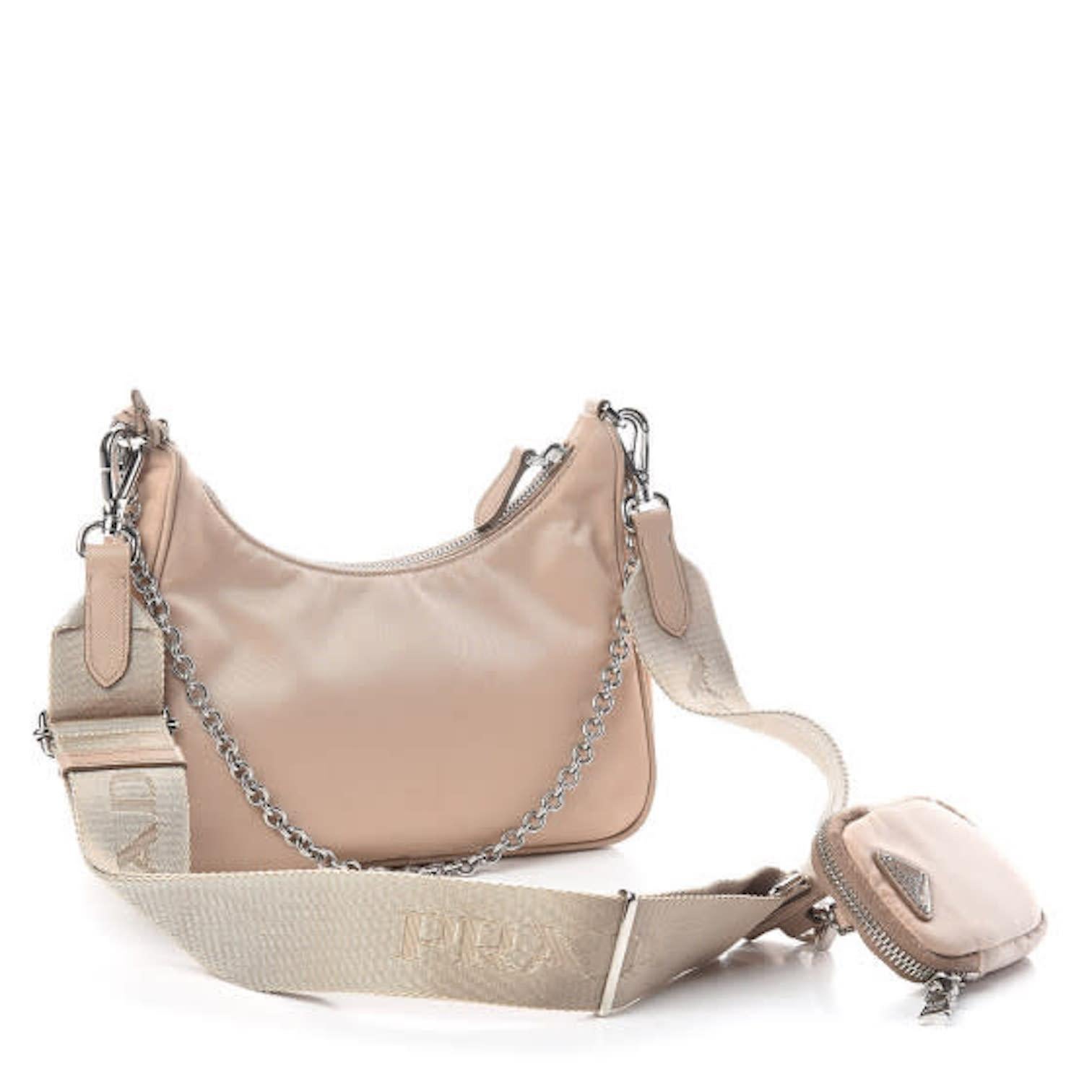 Featuring zipper closure, enameled metal triangle logo, woven handle and Prada logo nylon lining.

COLOR: Beige
MATERIAL: Saffiano leather
ITEM CODE: 538454
MEASURES: H 17 cm x L 22 cm x D 6 cm
DROP: 4”
COMES WITH: Dust bag & care card
CONDITION: