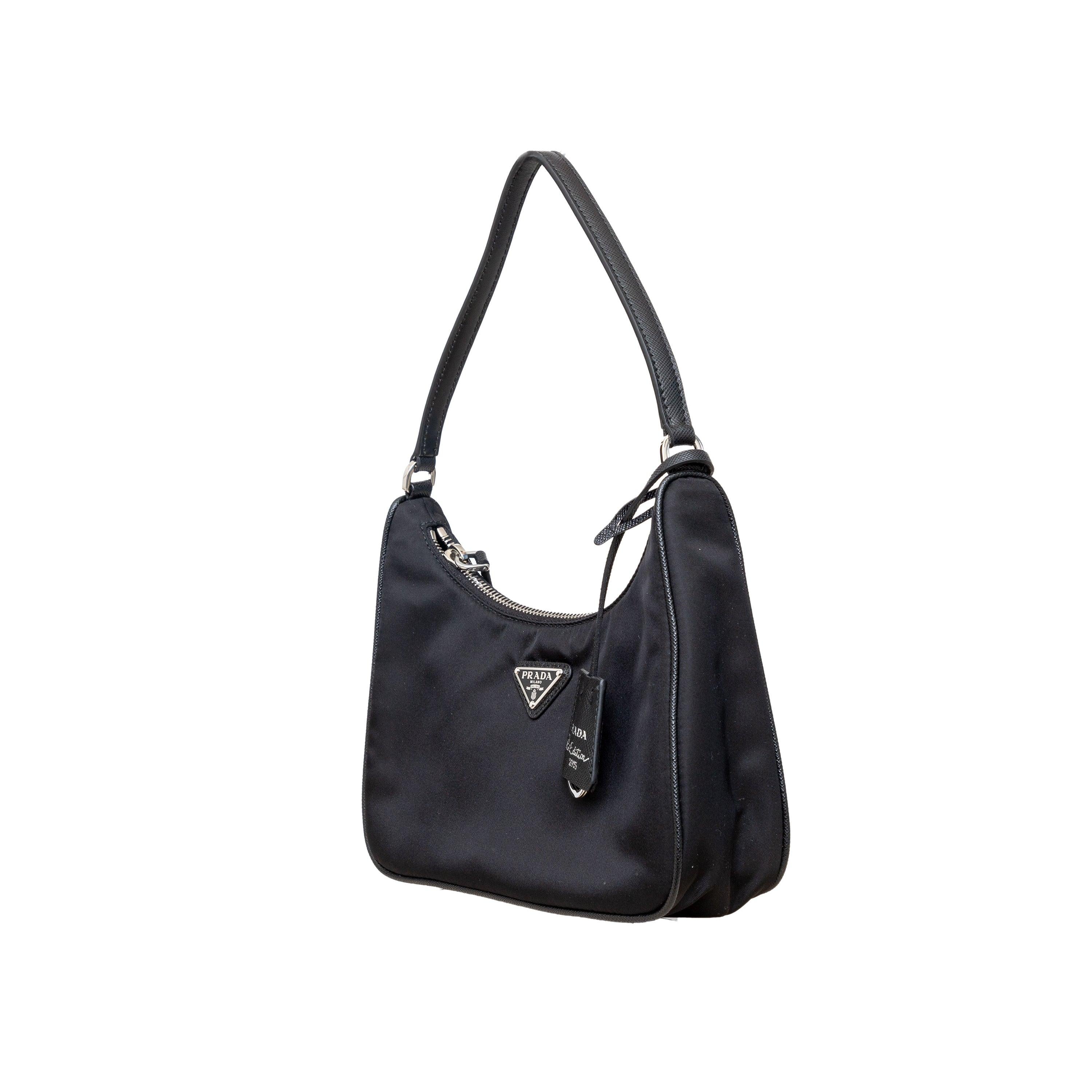 Introducing the Prada Re-Edition 2005 shoulder bag. Inspired by the iconic mini hobo bag, it is made of sustainable and stylish Re-Nylon. The bag features a mix of materials including iconic Saffiano leather trim and is perfect for everyday
