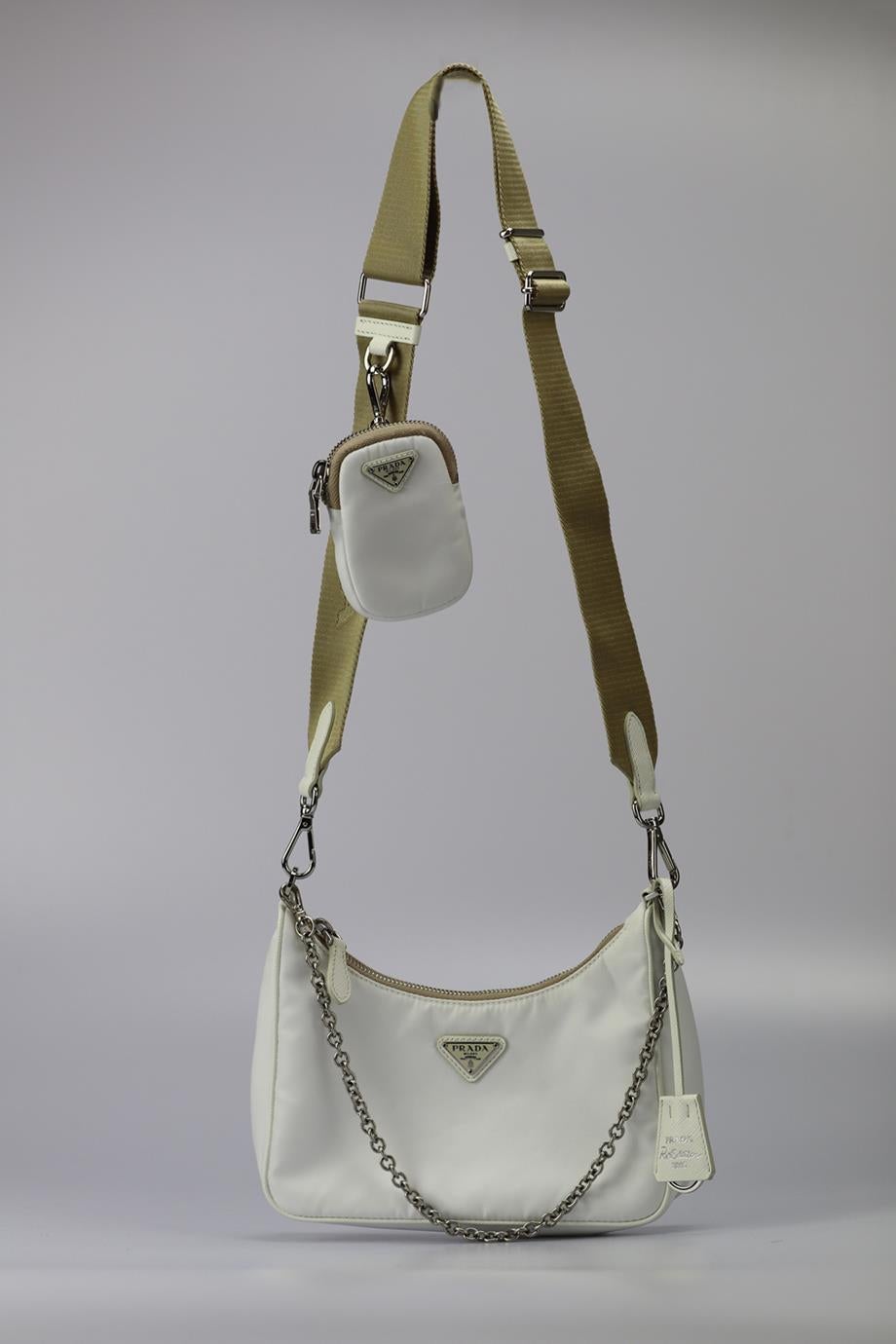 Prada Re-edition 2005 Textured Leather And Nylon Shoulder Bag. White. Zip fastening - Top. Does not come with - dustbag or box. Height: 6.3 In. Width: 8.5 In. Depth: 2.2 In. Handle drop: 10.5 in. Strap drop: 18.7 In. Condition: Used. Very good