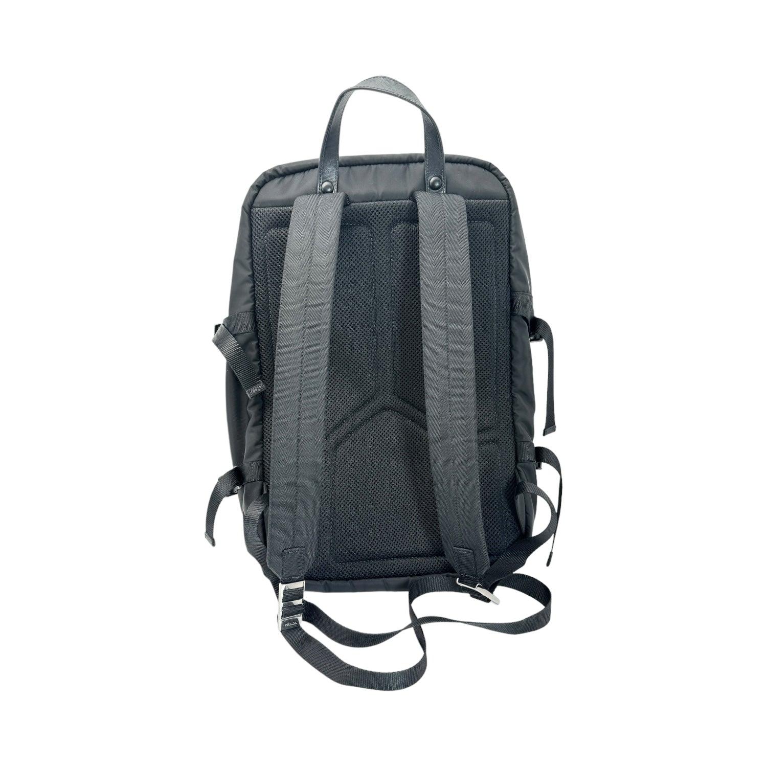 Elevate your style with the Prada Nylon and Saffiano Leather Backpack. Made from durable nylon and trimmed with luxurious Saffiano leather, this designer backpack exudes sophistication. With three exterior zip pockets and a dual interior