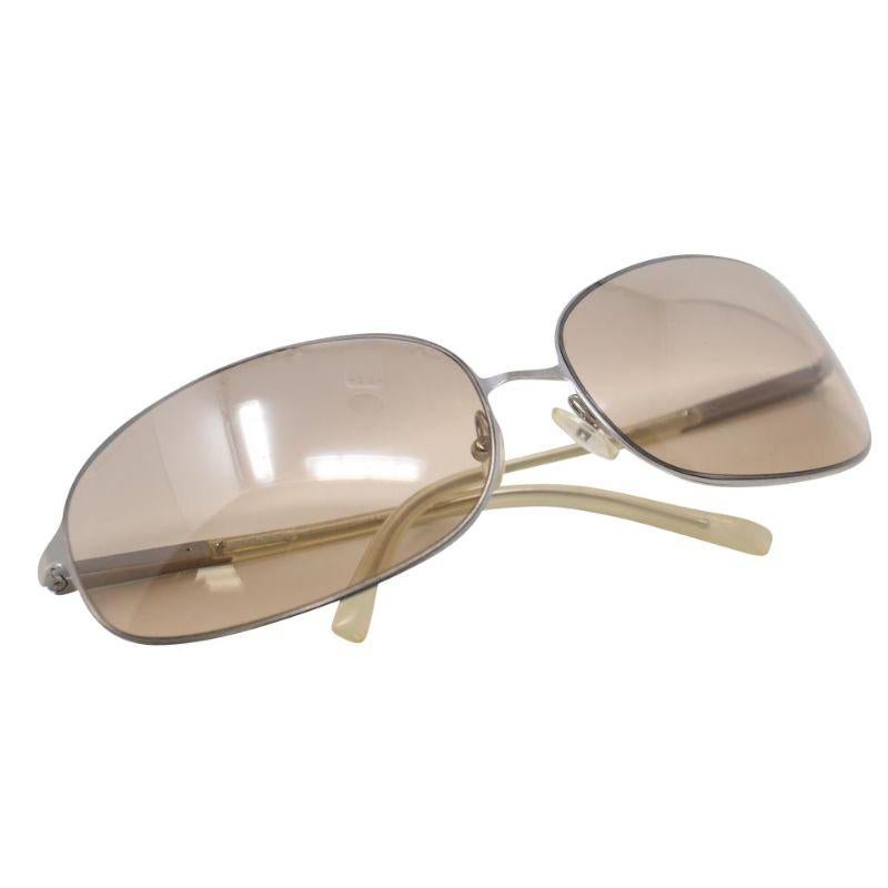 Prada Rectangular Sport SPR 50E Large Metal Sunglasses

Perfect for an active or leisurely lifestyle, this pilot style by Prada is high-performance and stylish. These shades are in mint condition with only minor hairline scratches on lens. Frames