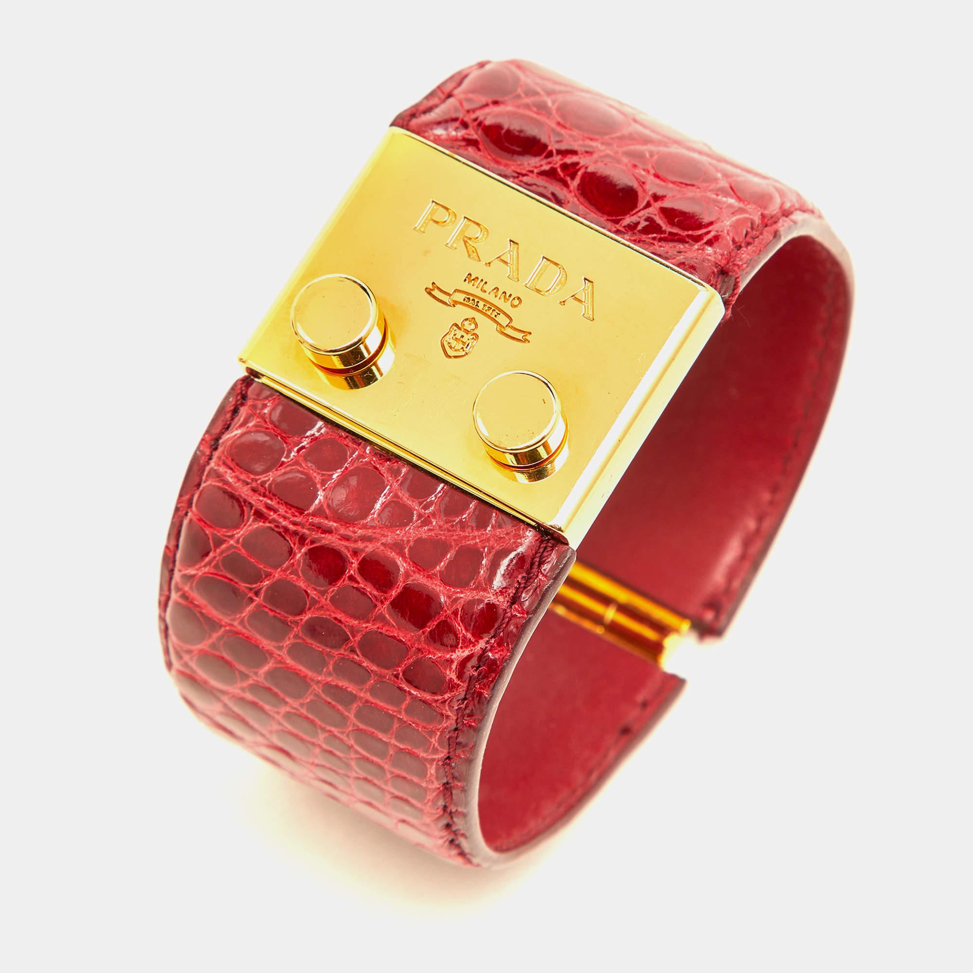 This beautiful Prada wide cuff bracelet is sure to stand out when it sits on your wrist. Crafted with precision using alligator leather and gold-tone metal, the fine bracelet will be an investment you'll love.

