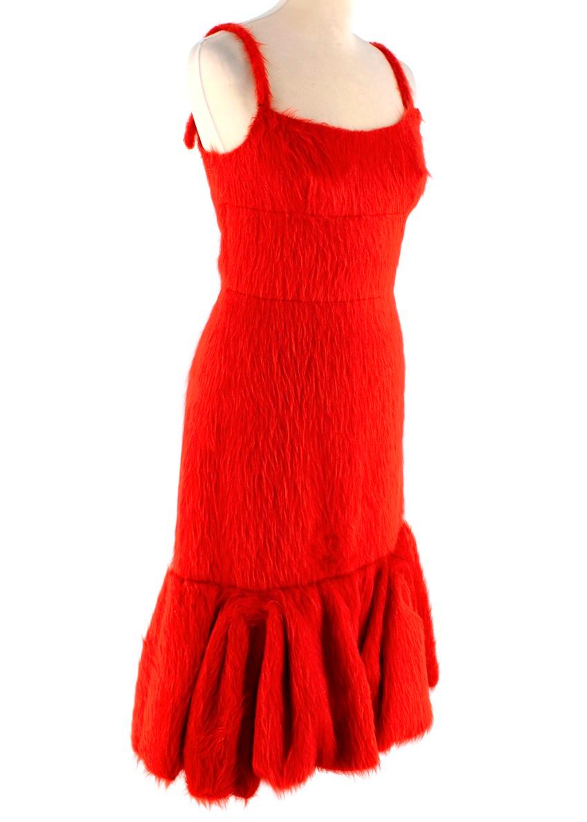 Prada Red Alpaca Silk Blend Fluted Cocktail Dress
 

 - Pillar box red hue, in signature Prada fluted hem silhouette
 - Thick strap, subtle sweetheart neckline
 - Fitted through the bodice & hip, kicking out with a gathered skirt tier
 - Concealed