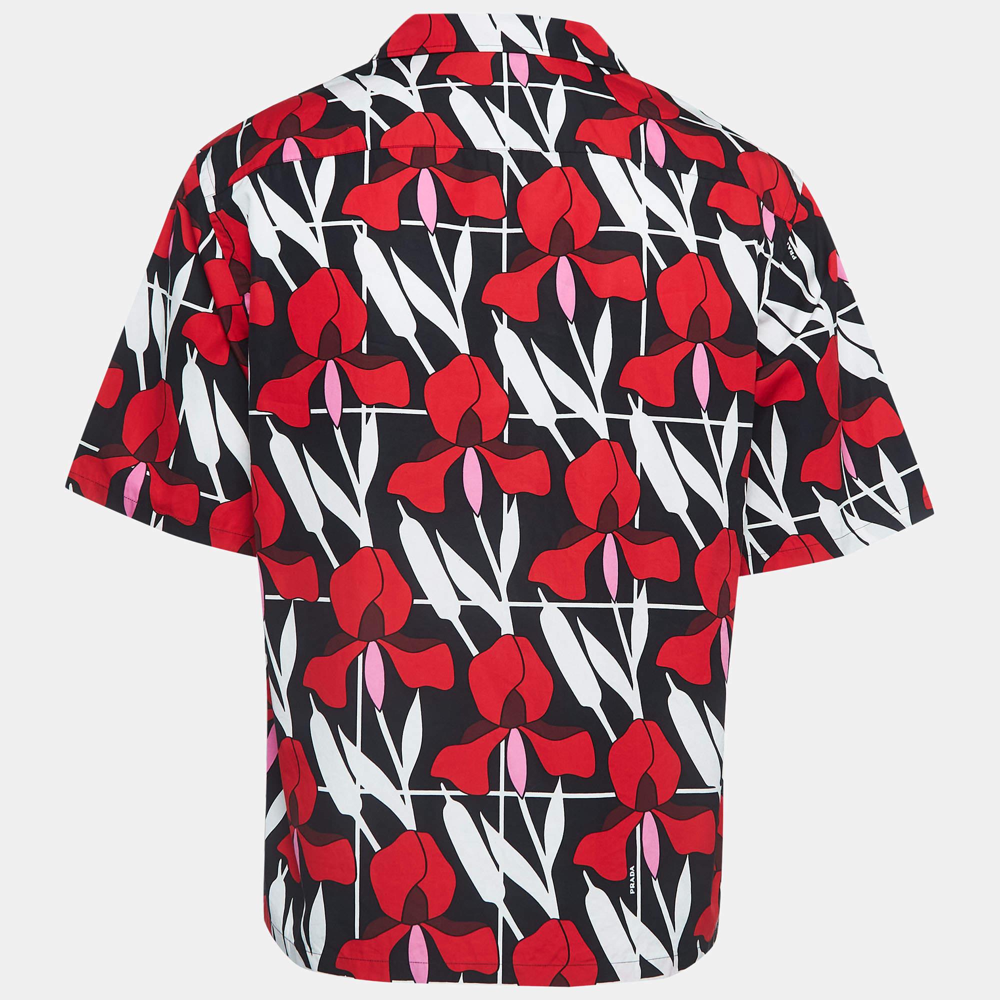 Tailored from quality materials, this Prada shirt has a fun and playful appeal. The creation is highlighted with floral print and is complemented with short sleeves, an external pocket, and front button fastening. Team it up with shorts for your