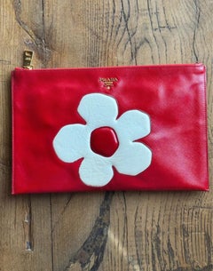 Prada red clutch with flower.