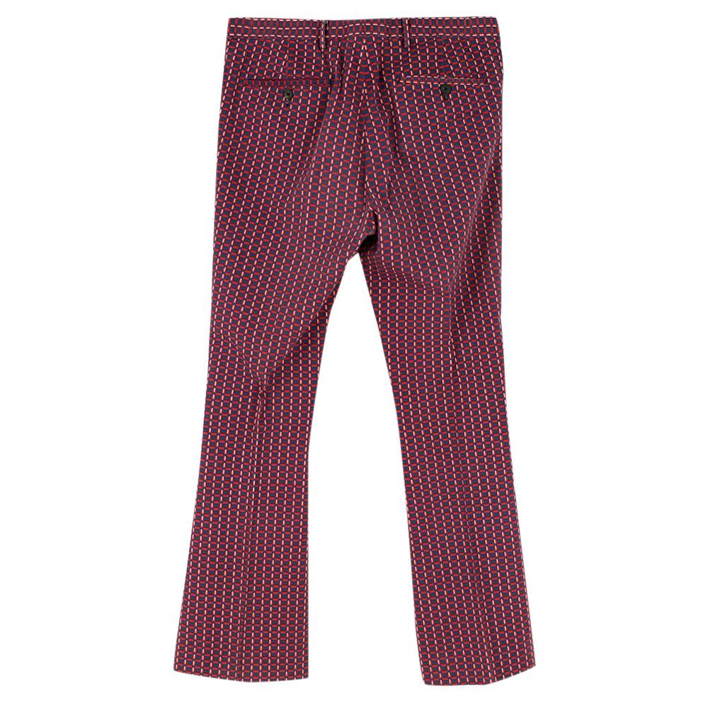Prada Red Cotton Patterned Flared Smart Trousers

- These luxurious Prada pants are a stylish piece made for any time of the season
- Featured Three front pockets, two back pockets 
- Front button fastening with silver clasp
- Flared cuffs
- Made in