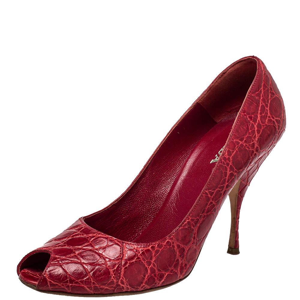 You are sure to love these amazing pumps from Prada as they're well-built and utterly gorgeous! They've been crafted from embossed leather in a red hue and designed with peep toes, 10 cm heels, and comfortable insoles.