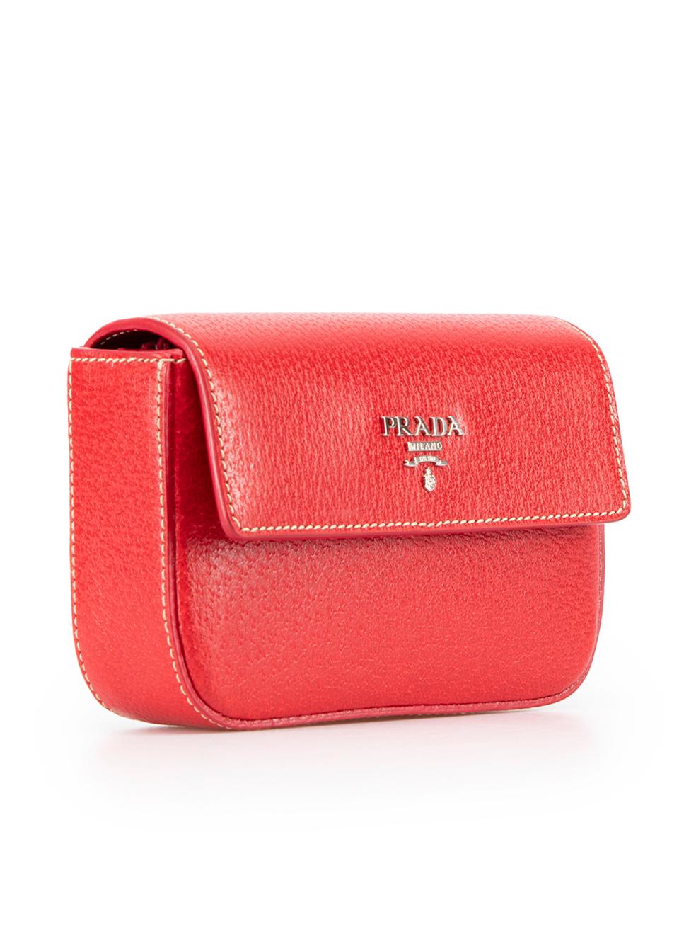 CONDITION is Never Worn. No visible wear to pouch is evident on this used Prada designer resale item. This item comes with original box.
  
  Details
  Red
  Leather
  Mini pouch
  Flap with magnetic button fastening
  2x Main compartments
  1x Zip