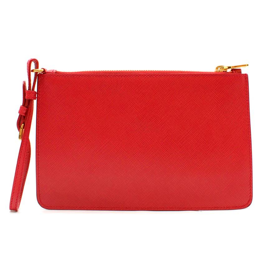 Prada Red Leather Pouch

- Red saffiano leather pouch
- Zip fastening
- Gold-tone metal
- Internal zipped pocket
- Front metal lettering logo
- Detachable and adjustable wristband strap

Please note, these items are pre-owned and may show some signs
