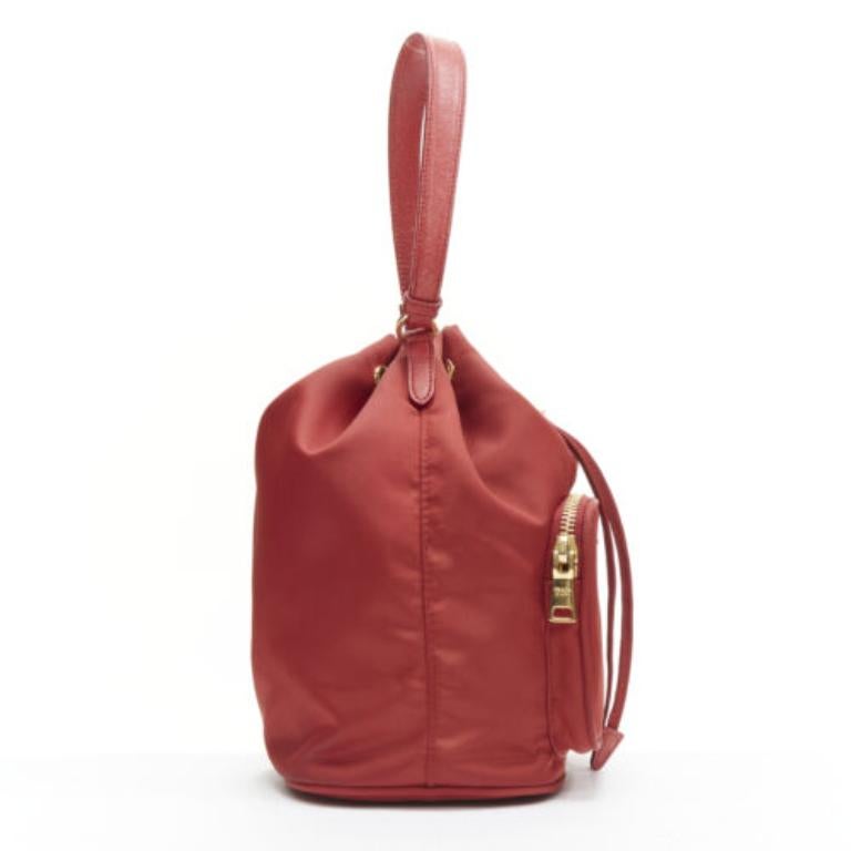 PRADA red nylon gold triangle plate drawstring bucket crossbody shoulder bag In Fair Condition In Hong Kong, NT
