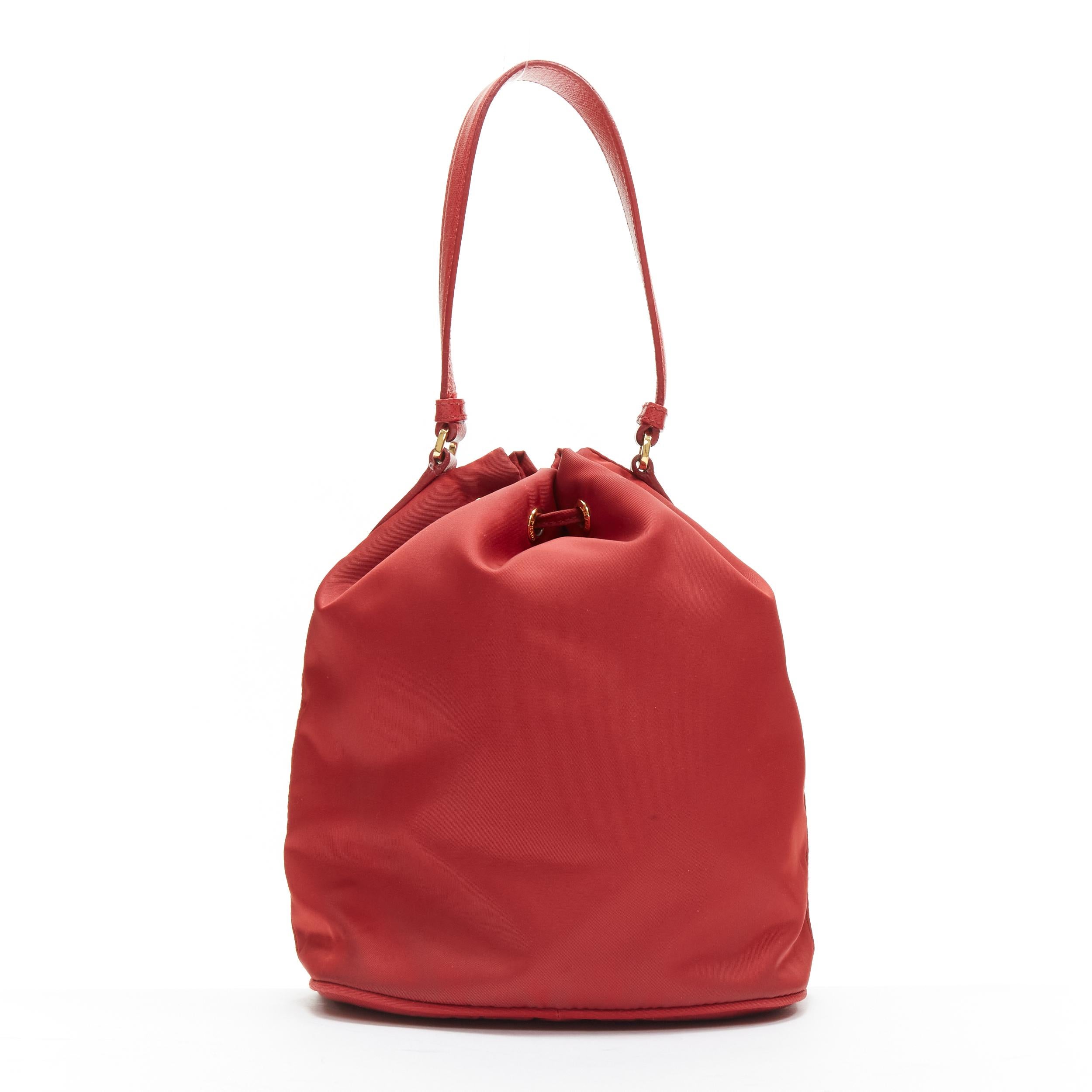 Women's PRADA red nylon gold triangle plate drawstring bucket crossbody shoulder bag