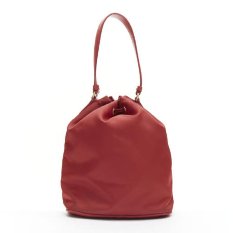Women's PRADA red nylon gold triangle plate drawstring bucket crossbody shoulder bag