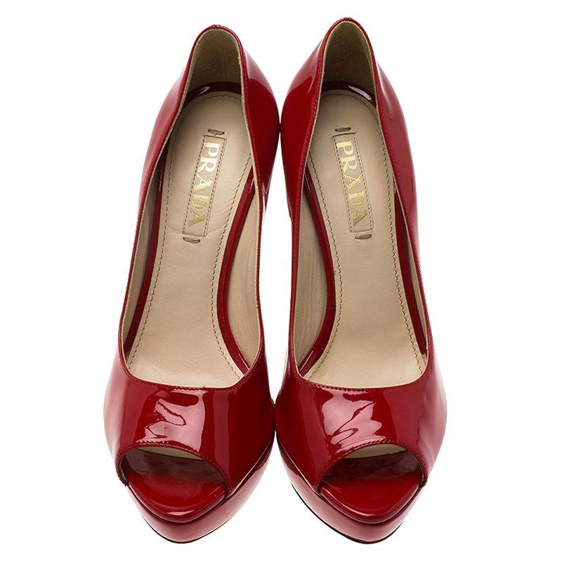 You can’t stop yourself from falling in love with these platform pumps from Prada. Crafted from red patent leather for a glossy look, they feature almond peep toes and 15cm stiletto heels supported with covered platforms. The padded insoles are