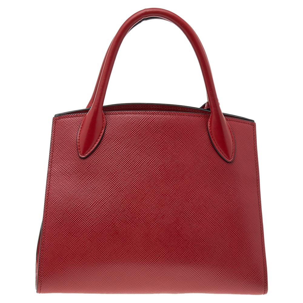 Know to create stylish, sophisticated, and timeless designs, Prada is a brand worth investing in. The bags that come from this Italian brand's atelier are exquisite. This tote bag is no different. Crafted in Italy, it has been made from Saffiano