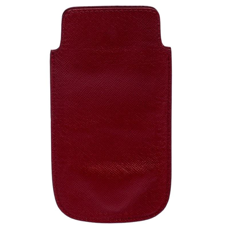 A truly sophisticated accessory for your precious iPhone, this Prada case is simply awesome. It is crafted from red Saffiano leather. The exterior features the brand logo at the bottom. This case could be your most favorite purchase.

Includes: The
