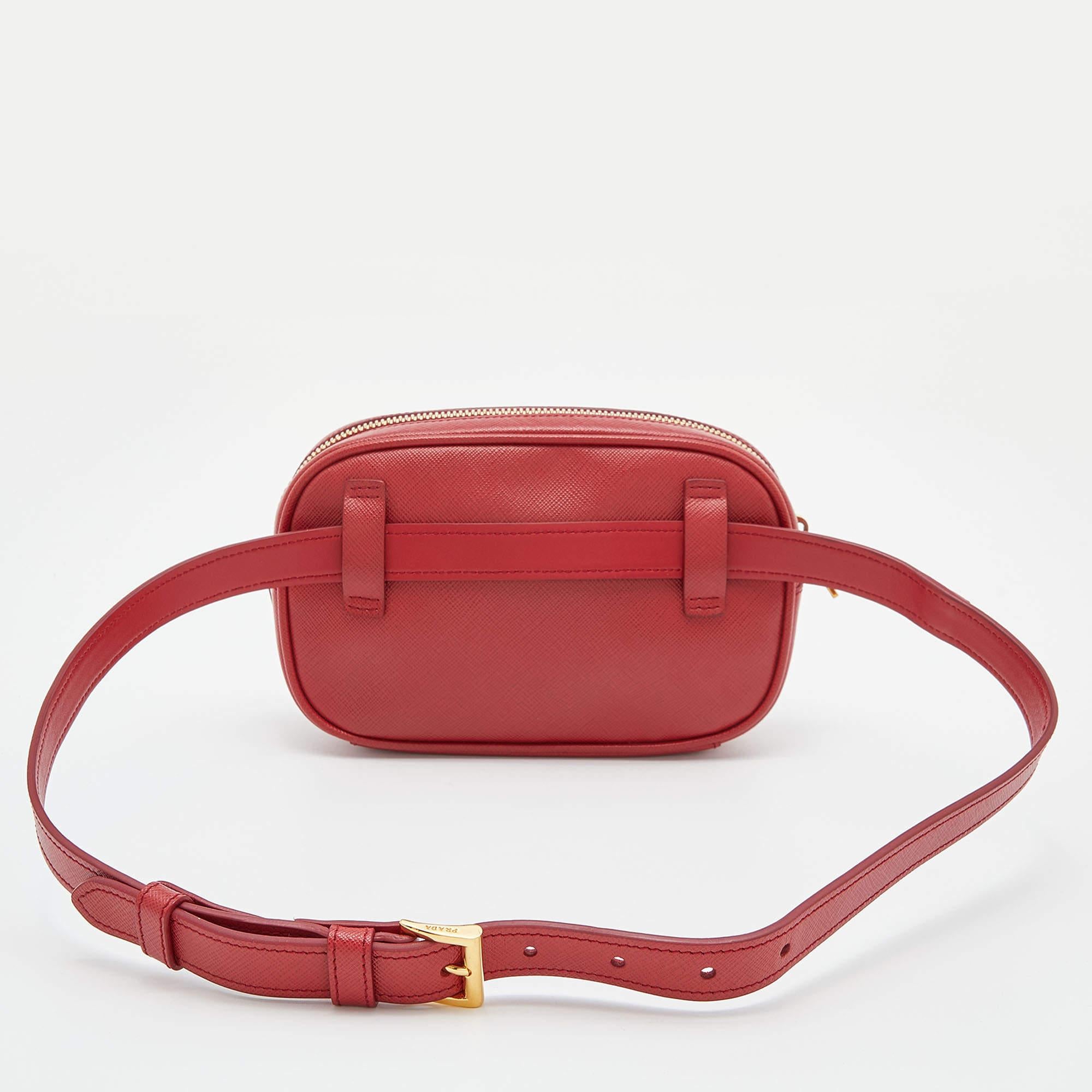 A functional bag with a unique convertible design, this bag by Prada is a winner. Crafted from Saffiano lux leather, it has gold-tone hardware. The nylon-lined interior has pockets to store your little essentials.

Includes: Original Dustbag, Chain