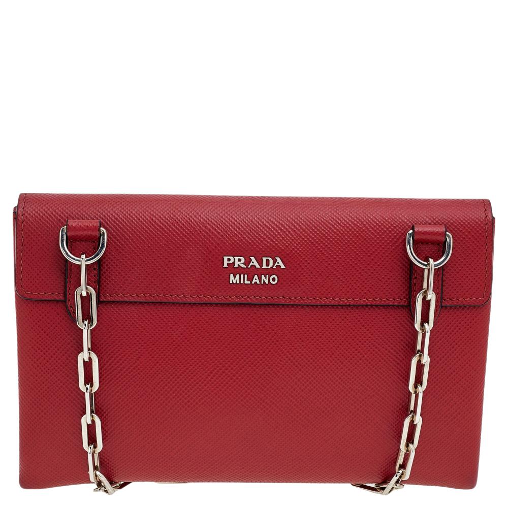 Step out in style by adorning this shoulder bag from Prada. It has been crafted from quality leather and flaunts two turn-locks on the front flap. The bag features a well-sized leather-lined compartment and is complete with a silver-tone shoulder