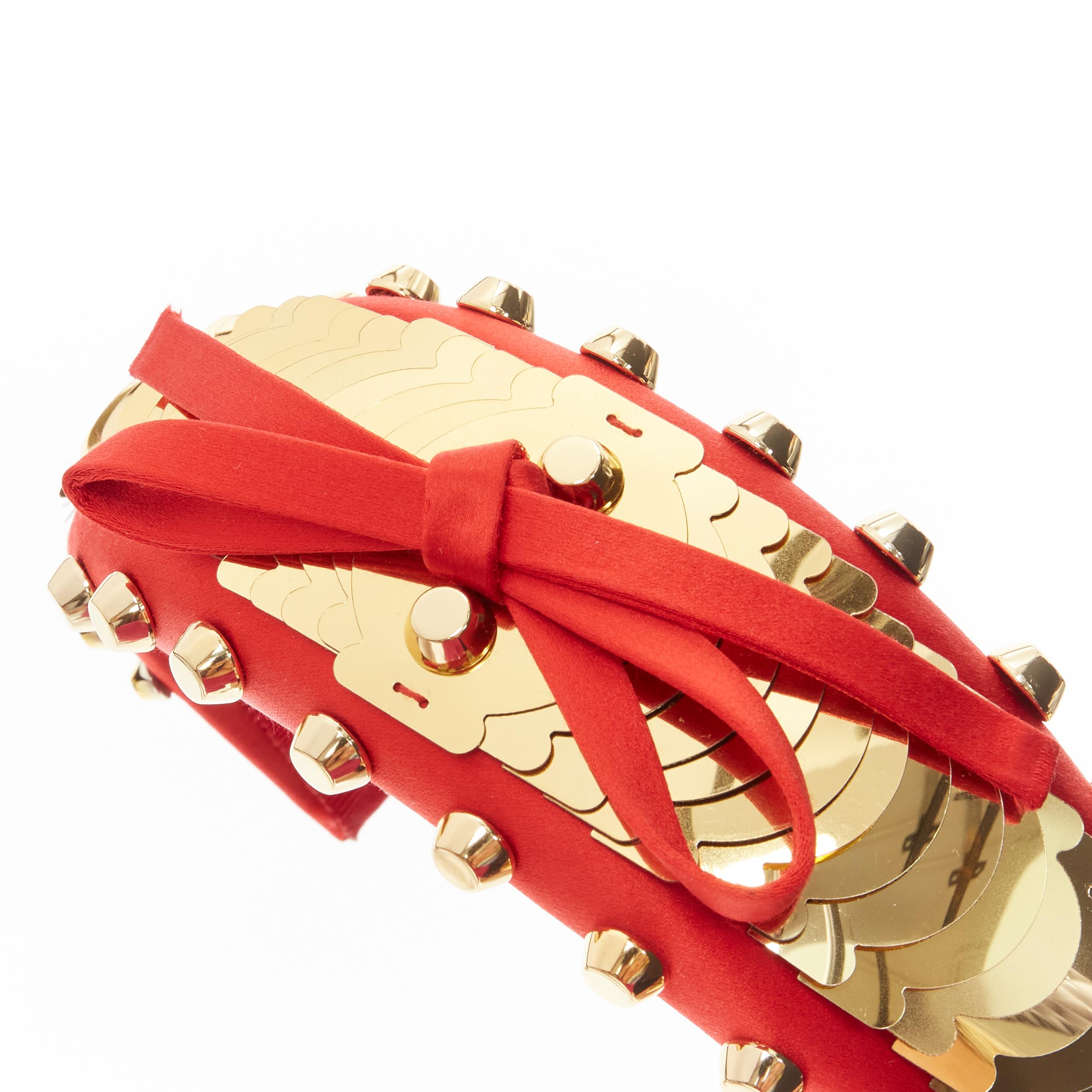 PRADA red satin gold pailette studded bow puffy headband 
Reference: ANWU/A00125 
Brand: Prada 
Designer: Miuccia Prada 
Material: Satin 
Color: Red 
Pattern: Solid 
Extra Detail: Decorative bow at top. 
Made in: Italy 


CONDITION: 
Condition: