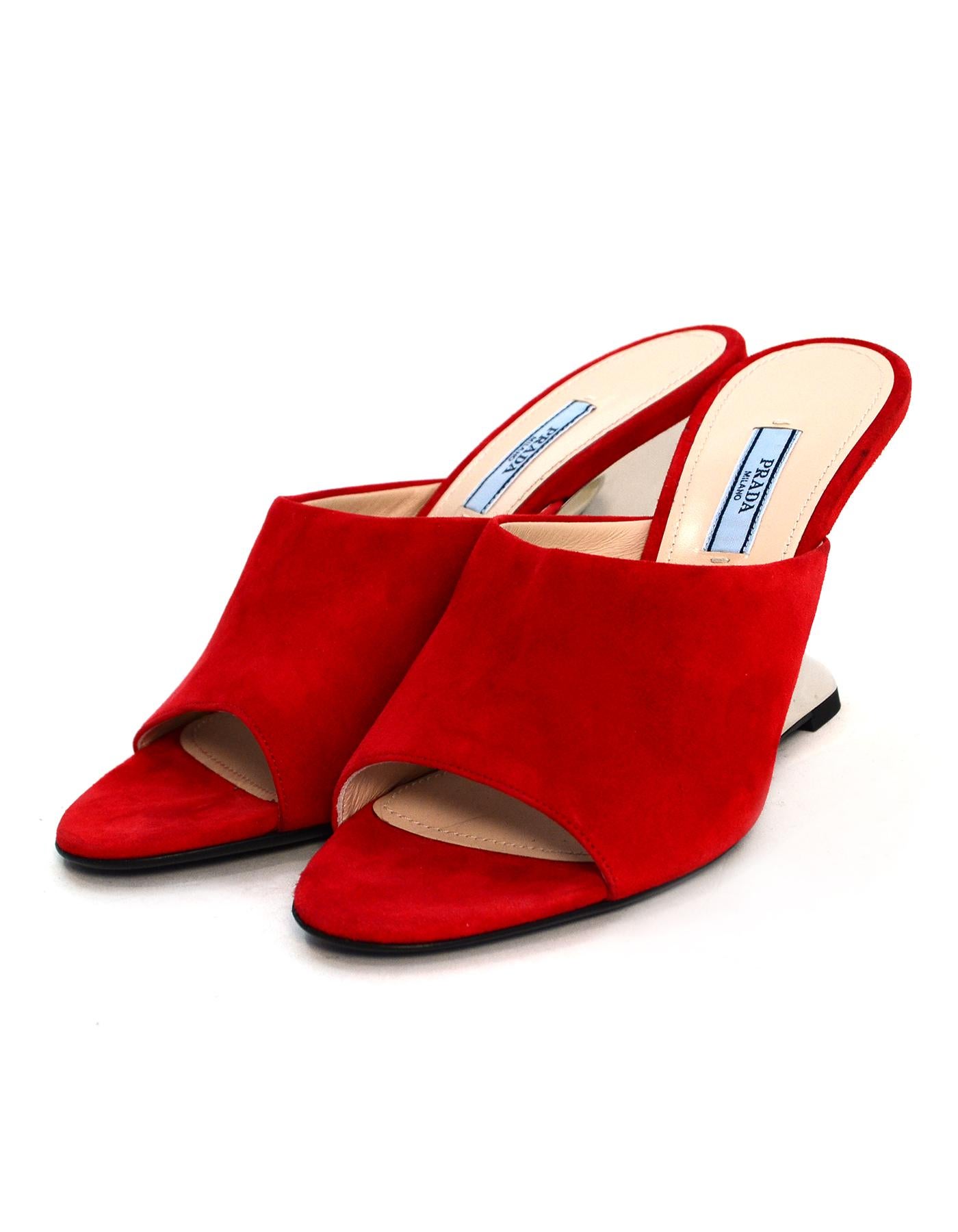 Prada Red Sculptural Metallic Wedge Heel Mules sz 39.5 rt $850

Made In: Italy
Color: Red
Materials: Suede
Closure/Opening: Slide on 
Overall Condition: New
Estimated Retail: $850 + tax
Marked Size: 39.5
Heel Height: 3.5