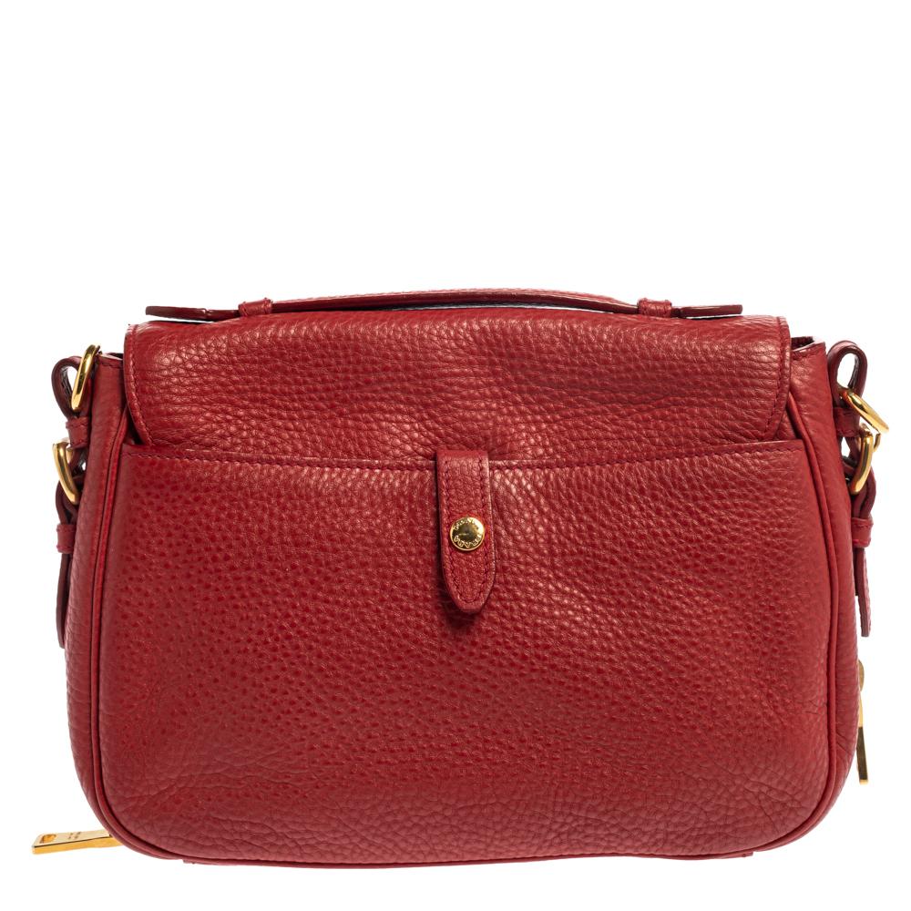 When it comes to creating timeless and chic bags, Prada always takes the lead. Crafted from Vitello Diano leather in a red hue, the bag features a front flap secured by a gold-tone push lock that opens to a spacious leather and fabric interior for