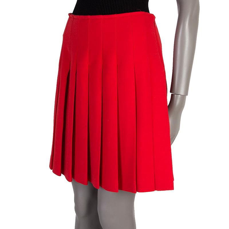 Prada pleated skirt in red wool blend (assumed as tag is missing). Closes with hook and invisible zipper. Unlined. Has been worn and is in excellent condition. 

Tag Size 42
Size M
Waist 76cm (29.6in)
Hips 94cm (36.7in) to 100cm (39in)
Length 48cm