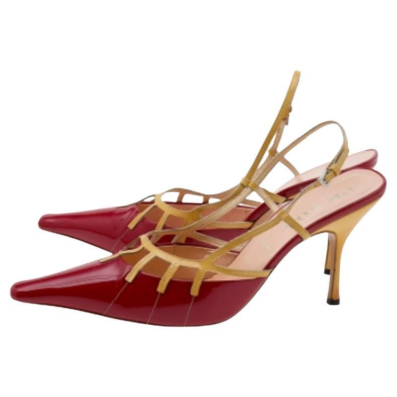 These sandals from Prada prove that fashion and comfort can go hand in hand too! The sandals are crafted from patent leather and feature pointed toes with buckle embellished vamps. They flaunt comfortable leather-lined insoles, slingbacks, and 10 cm