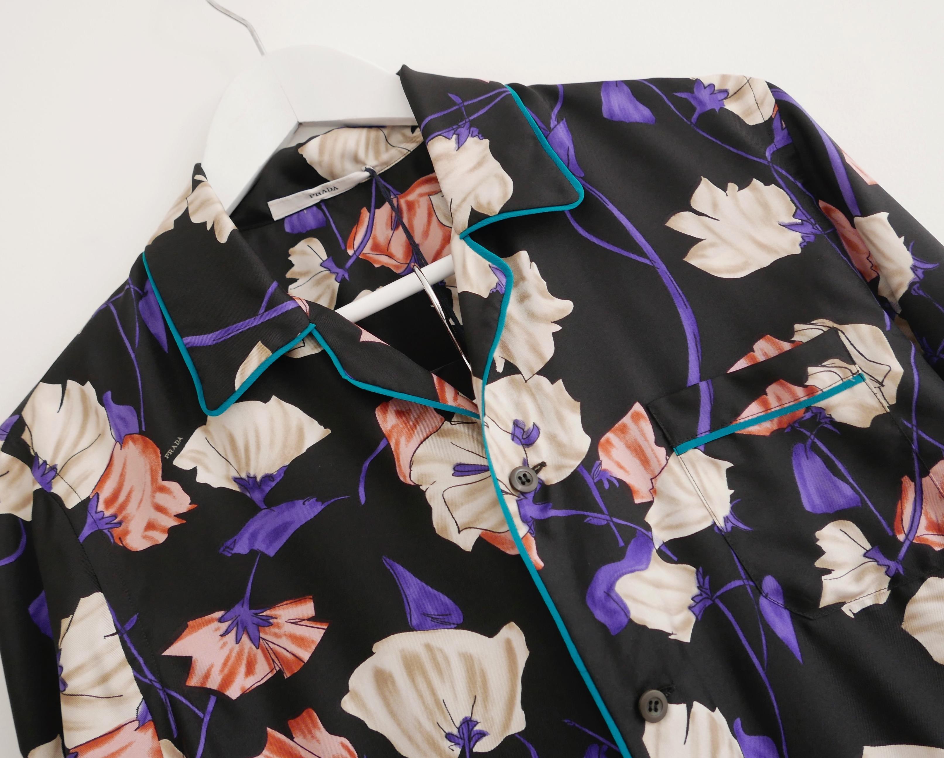 Stunning, super rare Prada lounge pyjamas (pajamas) from the Resort 2008 collection. In amazing new with tags/spare button condition and come with gorgeous matching silk dustbag. Can be worn inside or outside. Made from ultra soft black silk with a