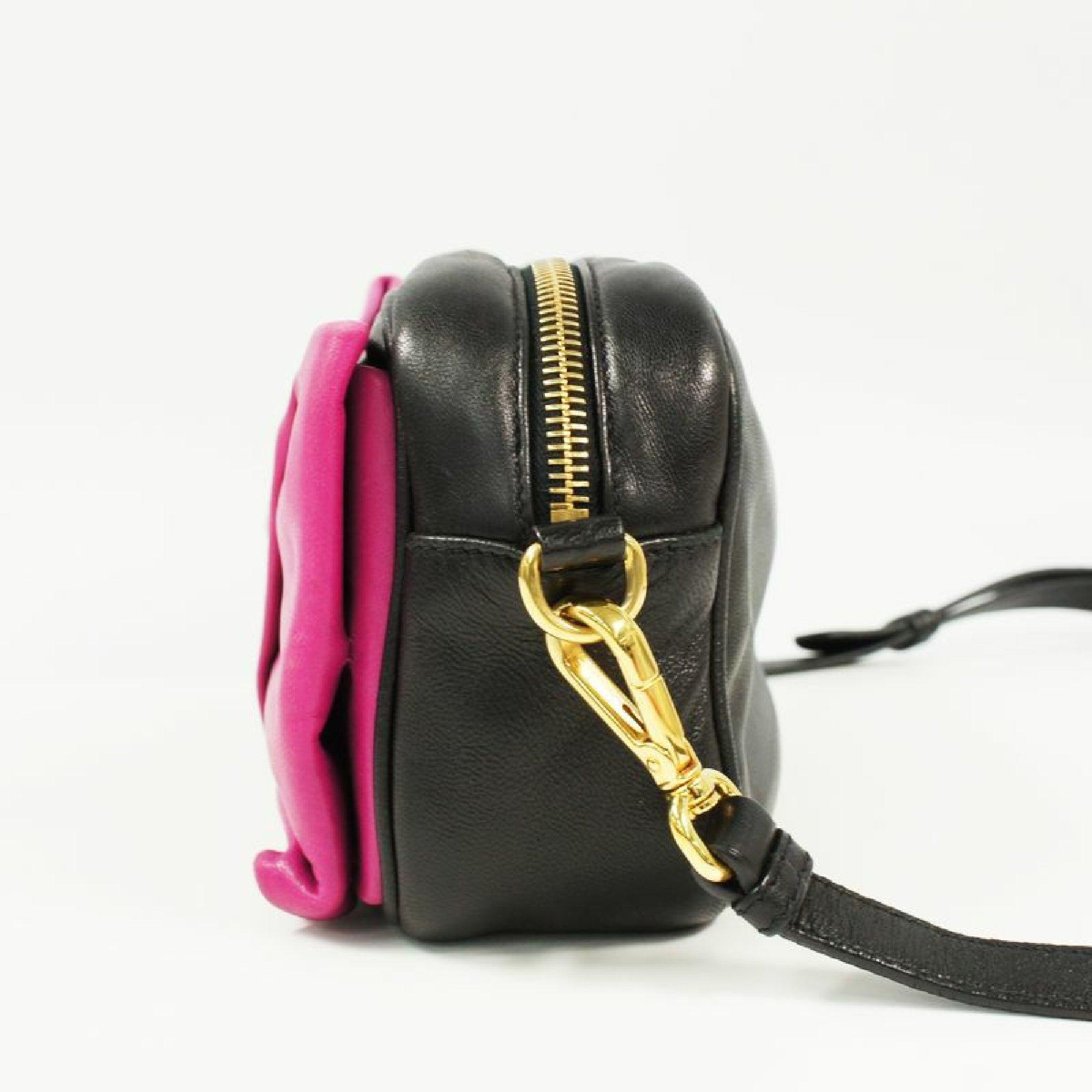 An authentic PRADA ribbon motif Mini shoulder 2WAY pouch Womens shoulder bag pink x black x g. The color is pink x black x gold hardware. The outside material is Leather. The pattern is ribbon motif  Mini shoulder 2WAY pouch. This item is