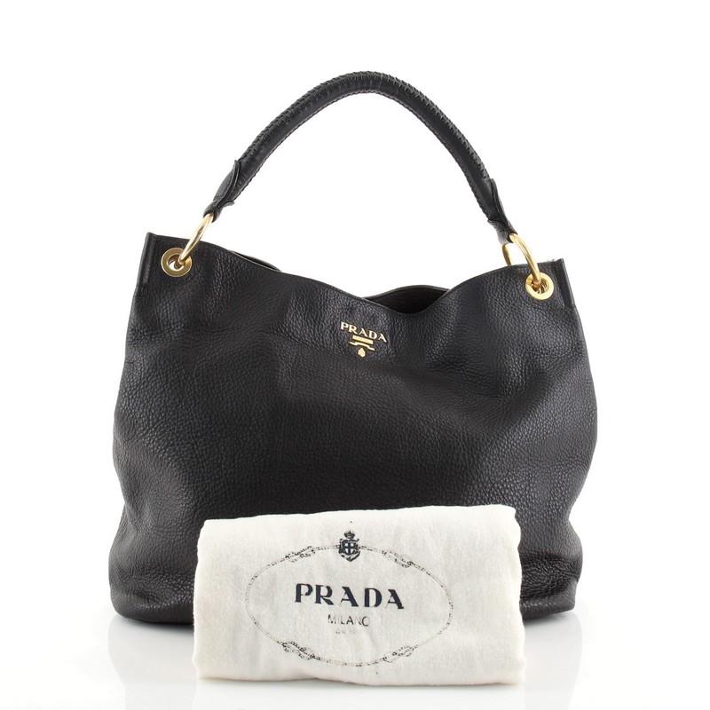 Condition: Good. Odor in interior. Wear on base corners, creasing on exterior, minor wear and scuffs on handle. Moderate cracking on handle base and opening wax edges, scratches and discoloration on hardware.
Accessories: Dust Bag
Measurements: