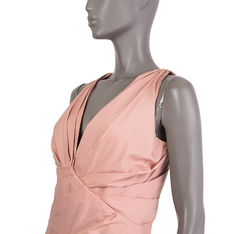 Prada pleated sleeveless dress in rose cotton (79%), nylon (17%), and elastane (9%). With v neck. Closes with pewter zipper on the back. Lined in rose fabric. Has been worn and is in excellent condition. 

Tag Size 44
Size L
Shoulder Width 28cm