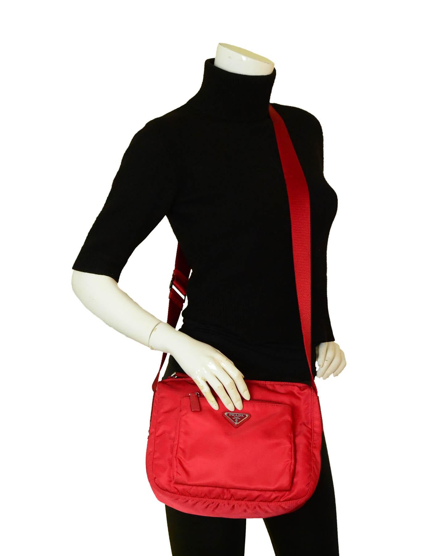 Prada Rosso Red Tessuto Nylon Front Pocket Messenger Bag

Made In: Italy
Color: Red
Hardware: Silvertone
Materials: Nylon
Lining: Red logo printed fine textile
Closure/Opening: Zip to
Exterior Pockets: Front zip
Interior Pockets: One zip and one