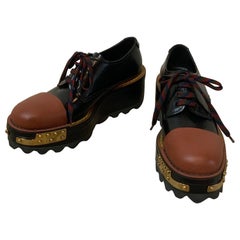 Prada RTW Automne 16 Mocassins en cuir noir et brun