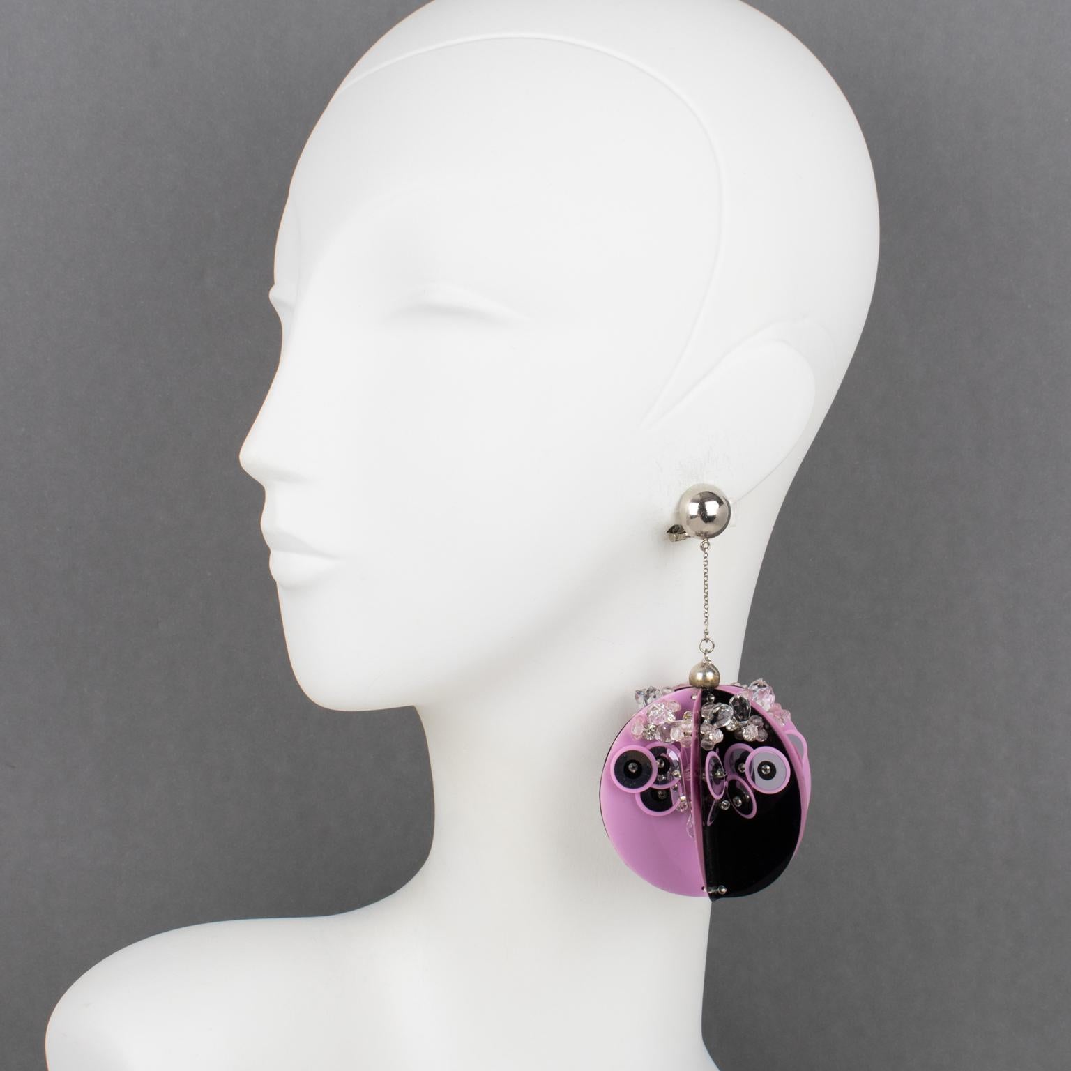 Prada, Italy, designed these sublime dangling clip-on earrings for its 2016 runway spring-summer ready-to-wear show. These rare oversized elegant earrings will make you shine no matter the occasion. They come from the house of Prada. This pair is