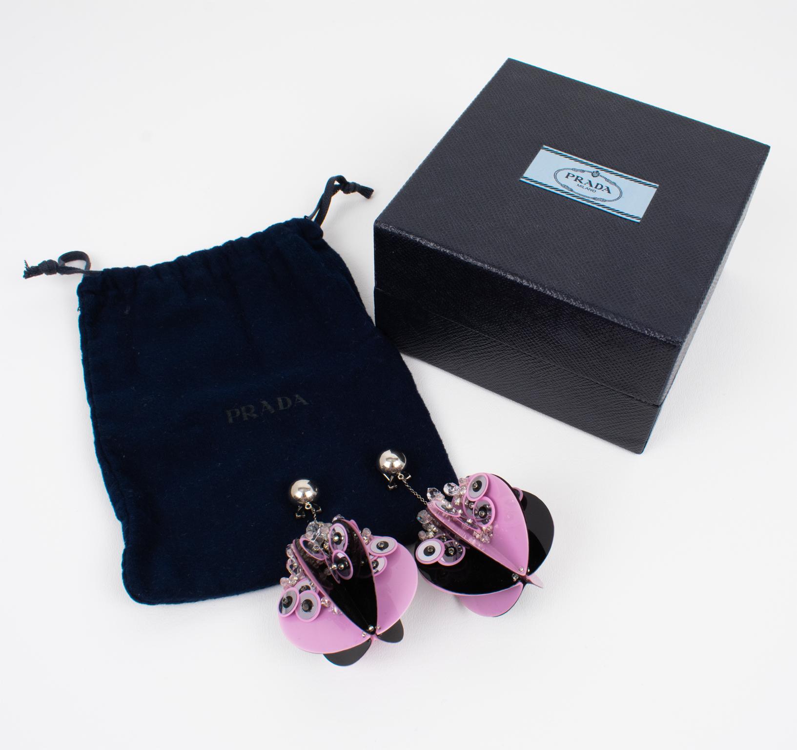 Prada, Italy, designed these sublime dangling clip-on earrings for its 2016 runway spring-summer ready-to-wear show. These rare oversized elegant earrings will make you shine no matter the occasion. They come from the house of Prada. This pair is