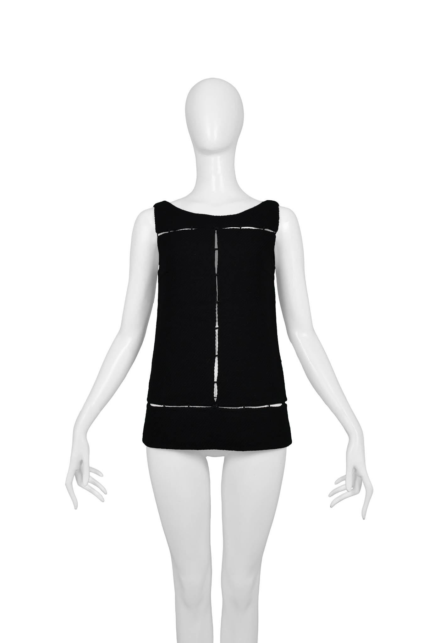 Resurrection Vintage is excited to offer a Prada runway wool top featuring cut-out panels, a sleeveless design, and a side zipper. 

Prada
Size: 38
100% Wool
Excellent Vintage Condition
Authenticity Guaranteed