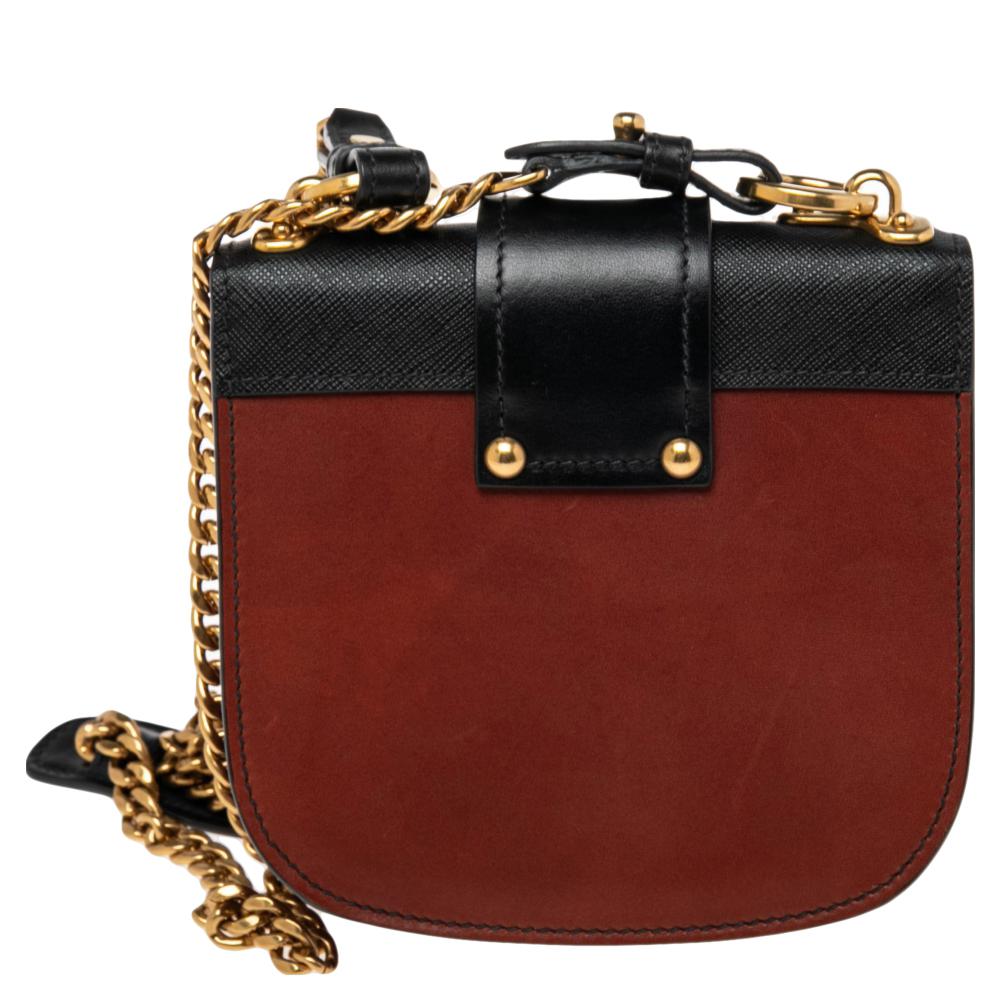 Inspired by valuable books from ancient times, the Cahier by Prada is a best-seller. This bag is crafted using leather and gold-tone hardware. The flap closure with the brand logo opens to a leather-lined interior with space for your essentials. It